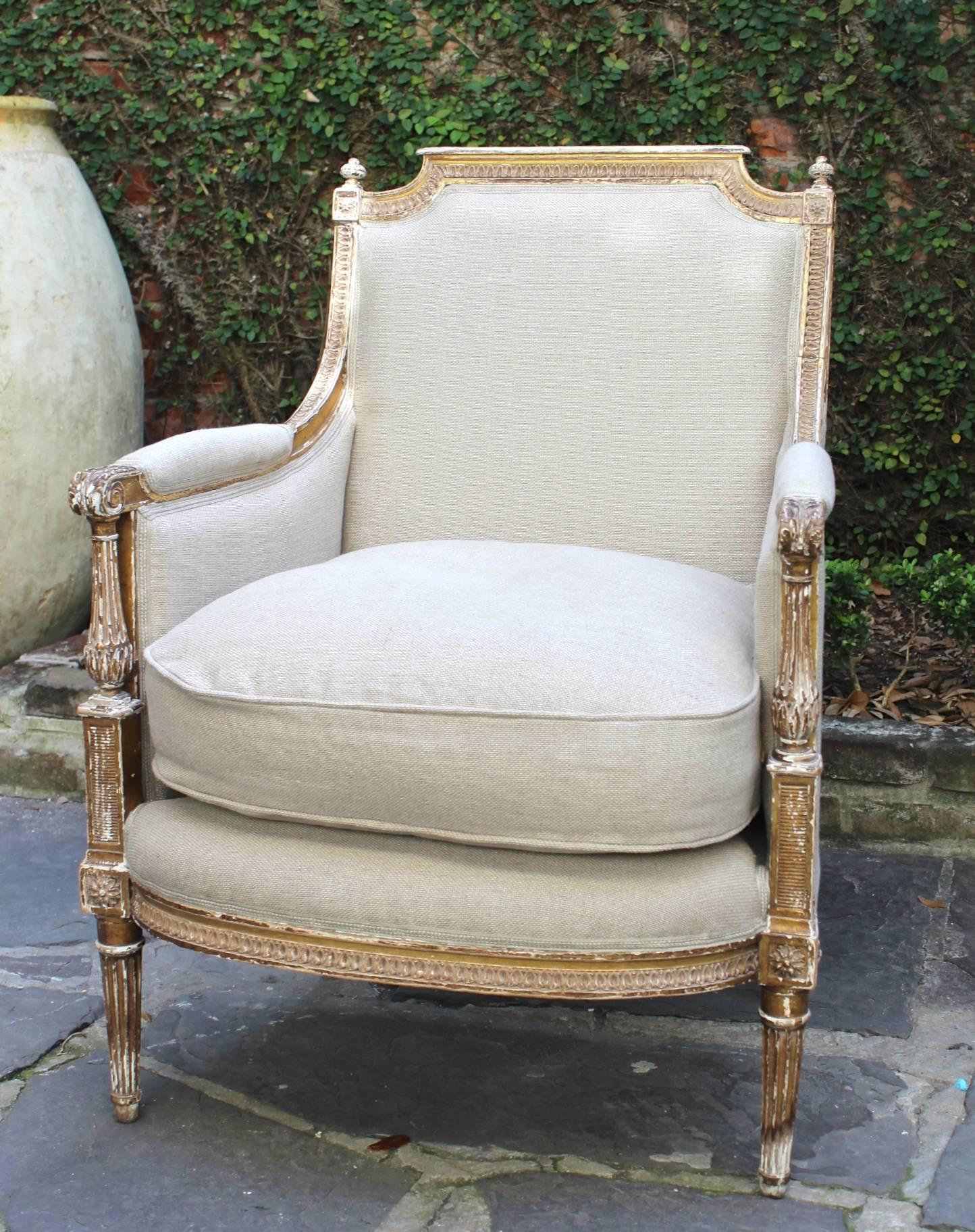 Pair of antique French late 18th-early 19th century gilded Louis XVI bergeres, completely taken down and reupholstered with French linen in Provence.