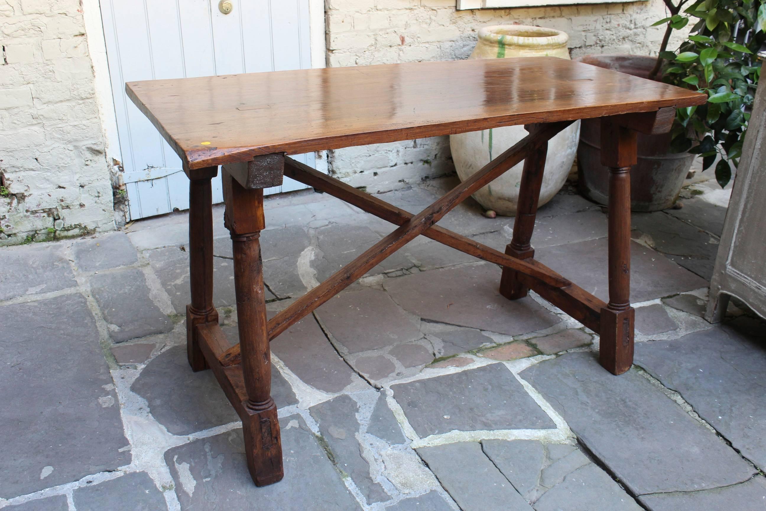 Antique French early 19th century walnut presentation table, with extremely rare top made from a single piece of wood.
 