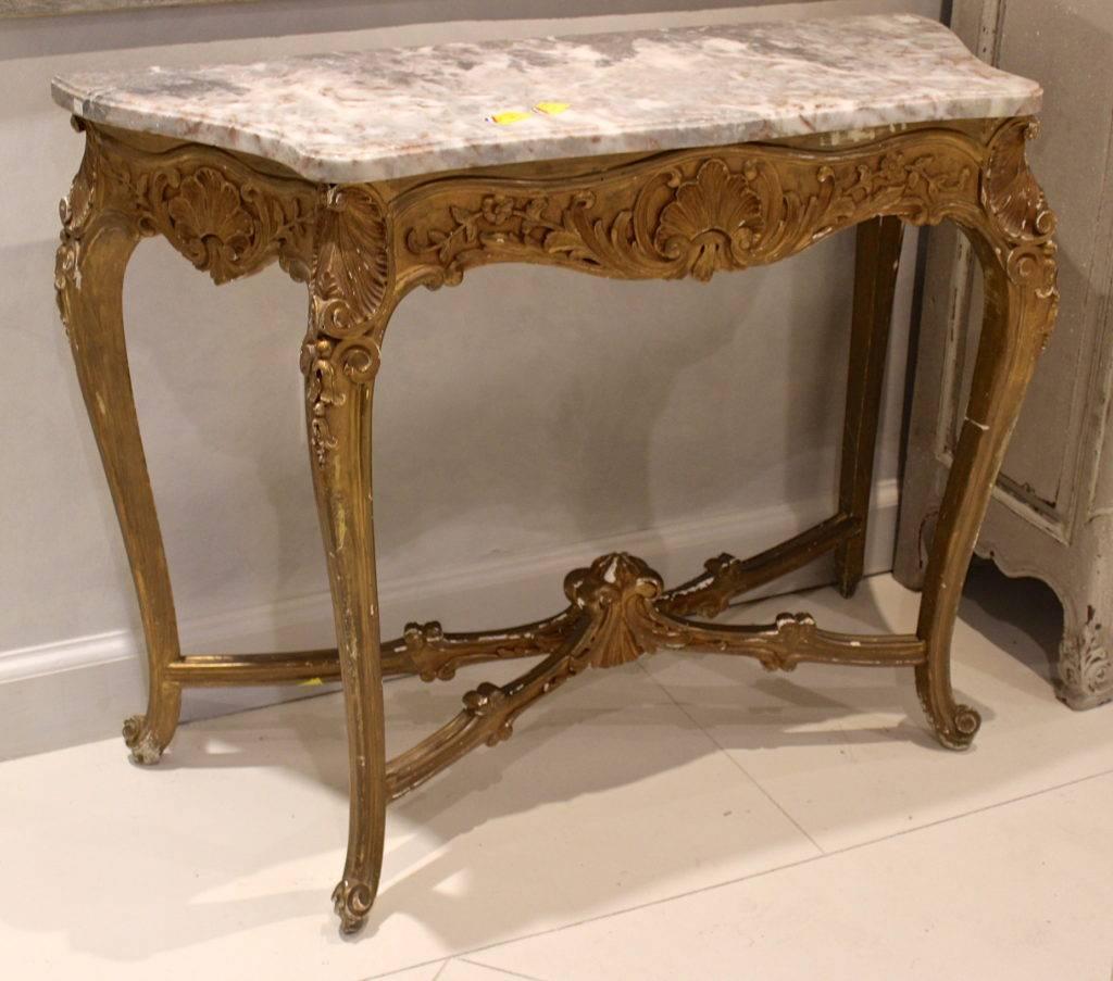 Antique French gilded console with marble top.
Regence Louis XV style with gilded walnut.
From the early 19th century with no restoration.