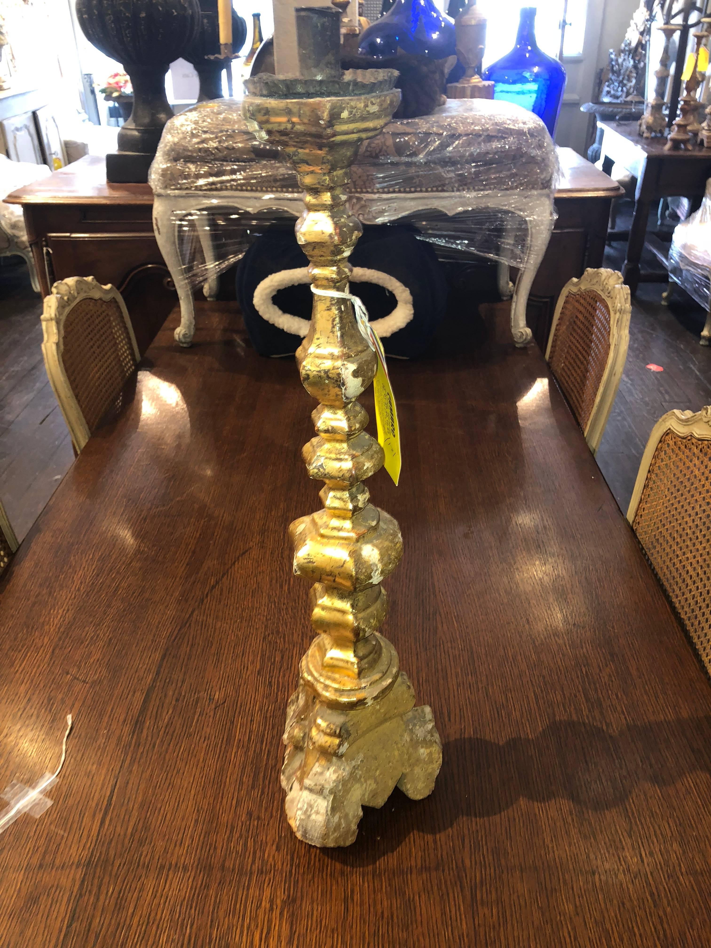 Antique French altar candlesticks that can be converted to lamps. Includes detailed carvings and gilded areas.
