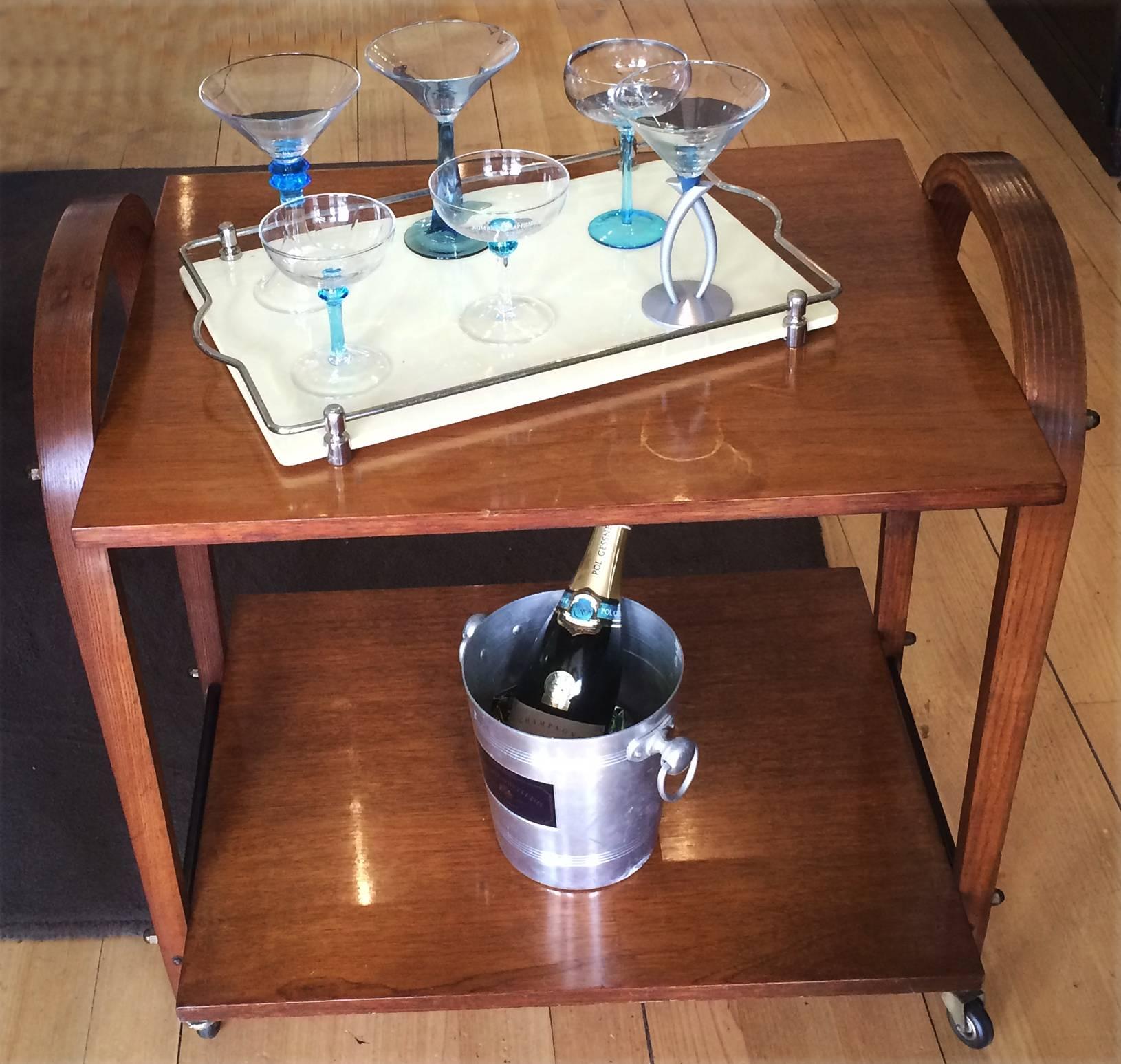 Unusual Mid-Century bentwood drinks trolley. The top tray is removable and can be used as a serving tray. An elegant trolley, finely crafted bentwood, with all original wheels intact and in perfect condition and all original brass dome capped nuts