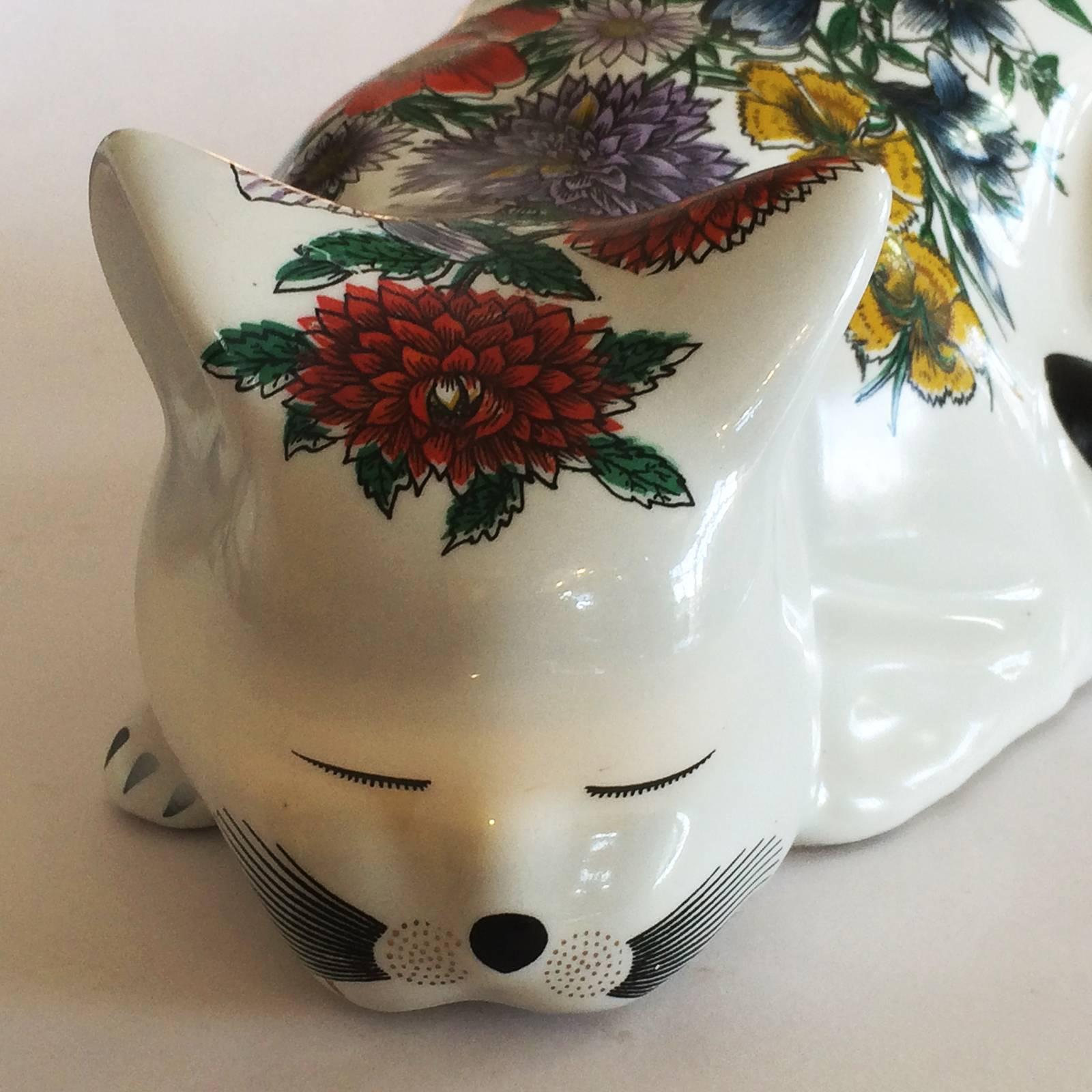 Mid-Century, rare, large size Fornasetti cat, sleeping. The artist has captured the cat form perfectly. Totally original condition, excellent, finely detailed floral display, with no damage or repairs. Marked to the rear, side in black, “FORNASETTI,