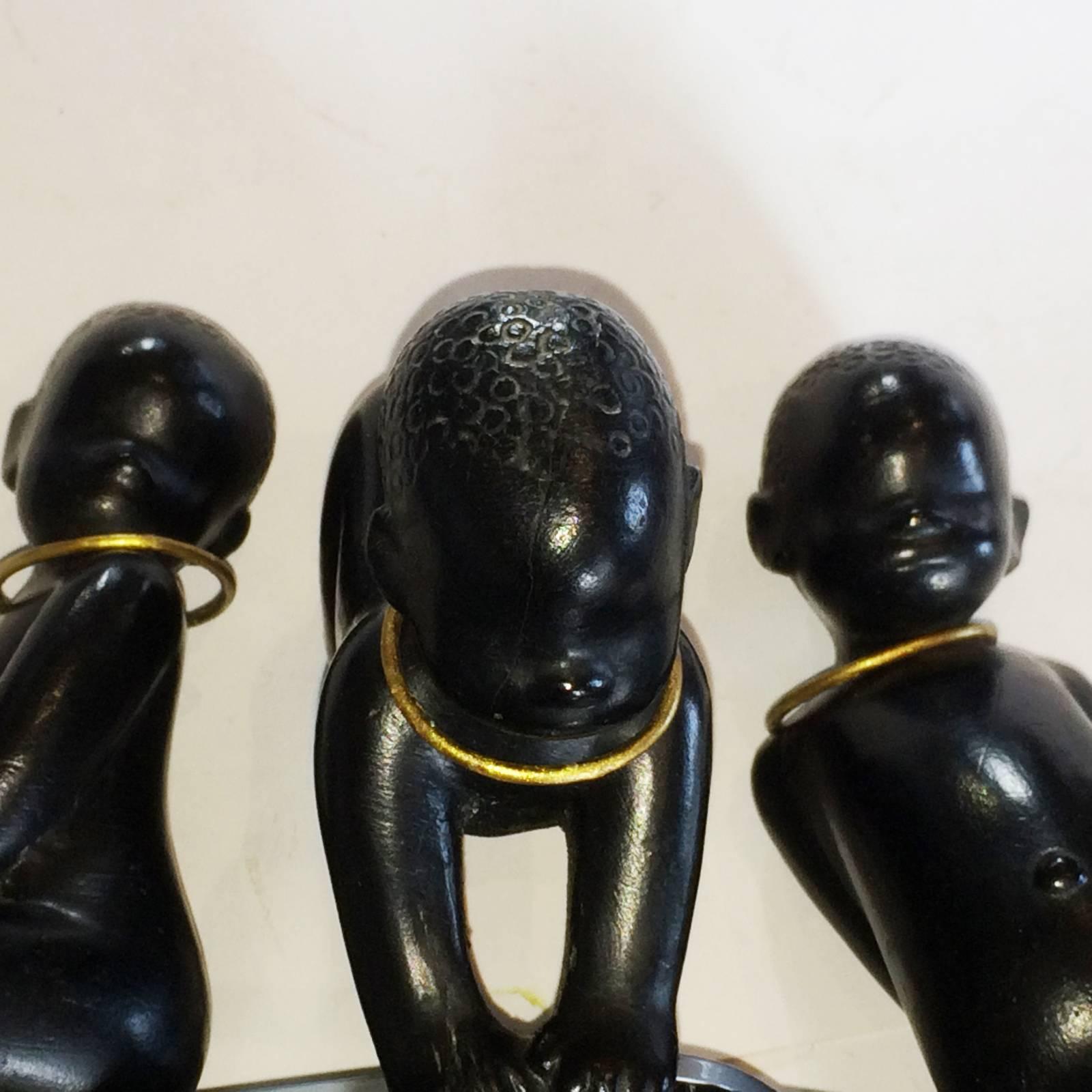 Art Deco Mid-Century Trio of Barsony Babies, Standing, sitting, crawling, in different age groups, each with the gilt finish decoration to the neck and the original green felted base still intact. All in excellent condition. These were in the manner