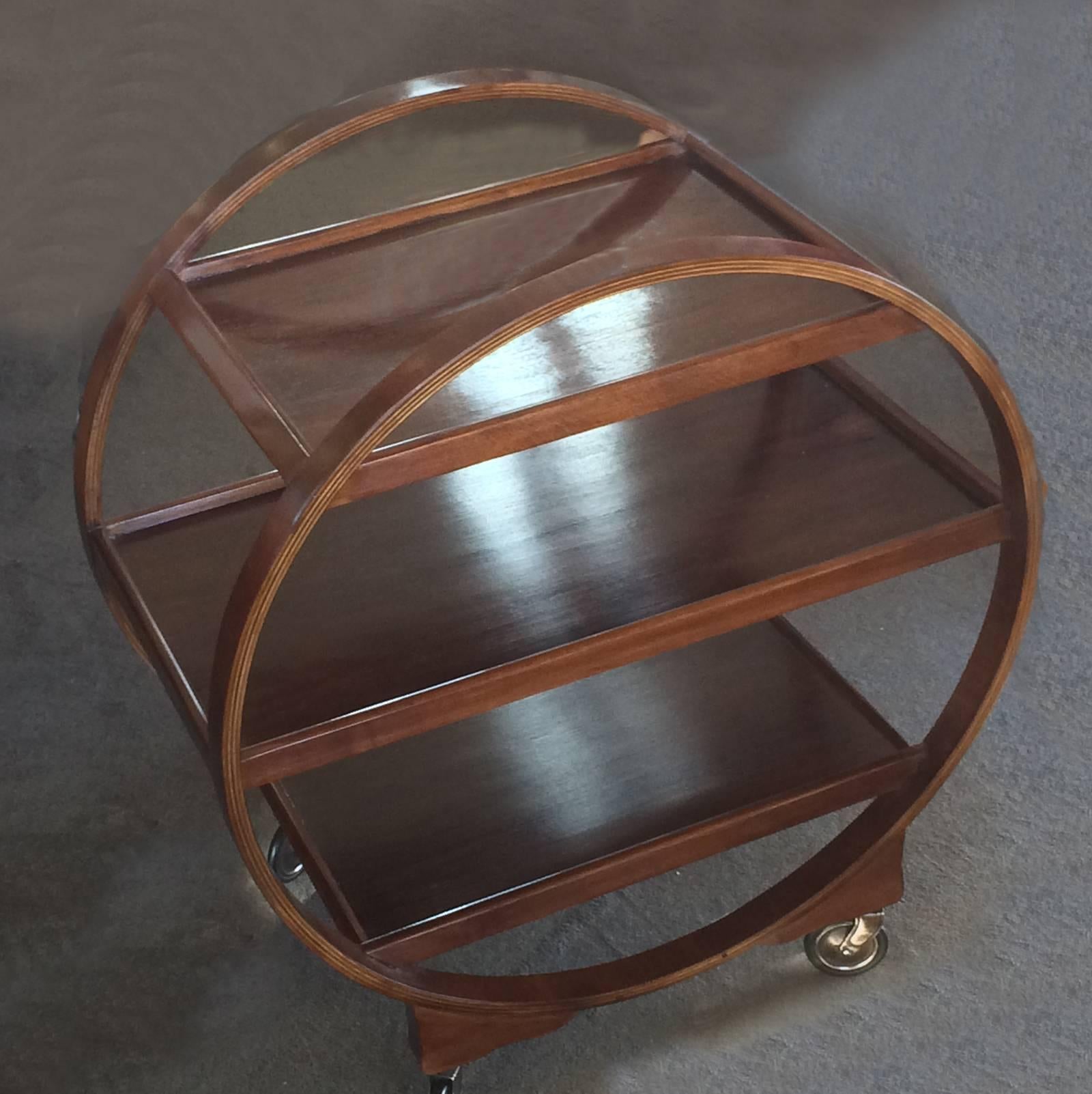 Art Deco bentwood, cocktail or tea trolley. Great, geometric design with three-tray levels and full circle bentwood support / handles. These are becoming very scarce, and are exceedingly rare in three levels and in such excellent condition; even the