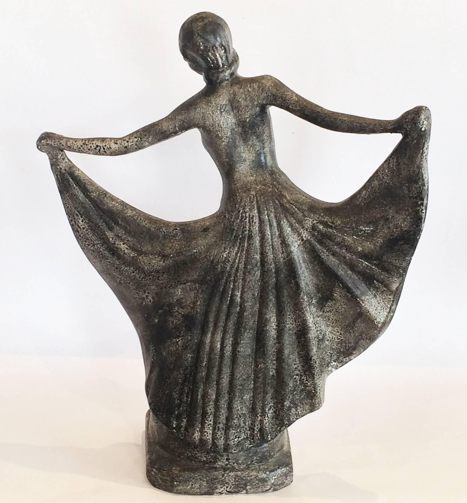 Art Deco statue of a half nude lady dancing, in terracotta with finely detailed black, grey, white “speckle like” but smooth surface, giving a veiled appearance to fine details and features, etc. but the detail of toes, hair and three dimensional