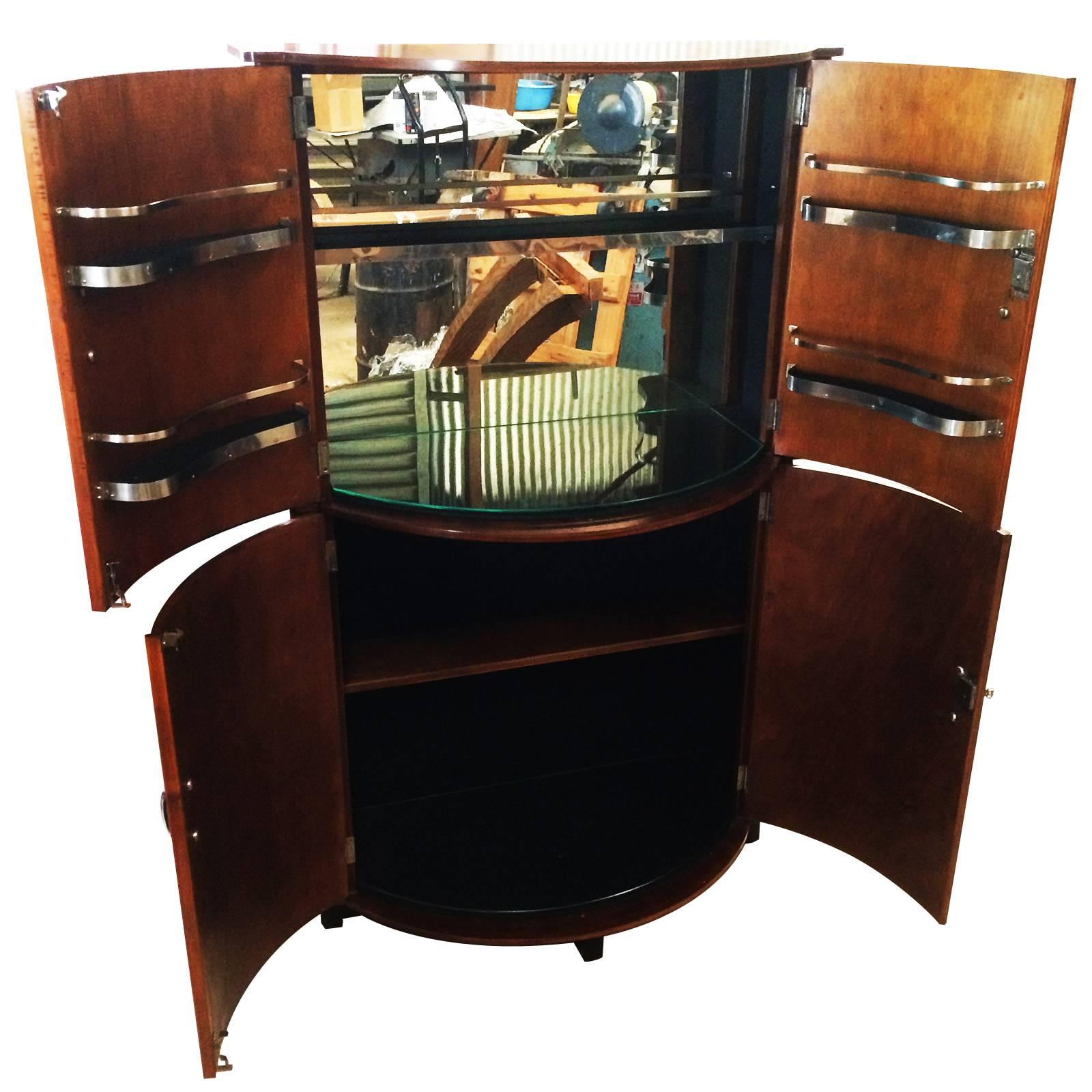 Art Deco English half round cocktail bar, drinks cabinet with a vertical rectangular rear section and a half round front with half round doors to front, the upper pair are fully fitted doors with two chromed shelves to each for glasses, and a