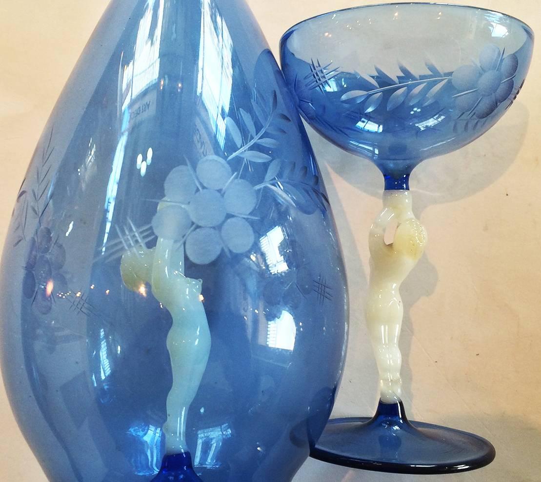 Art Deco Lauscha Bimini Decanter and Four Glasses in Blue and White, also finely engraved with flower and leaf pattern. . All pieces are made of “paper thin” glass, and amazingly light to hold. The set is designed with a relatively small glass, as