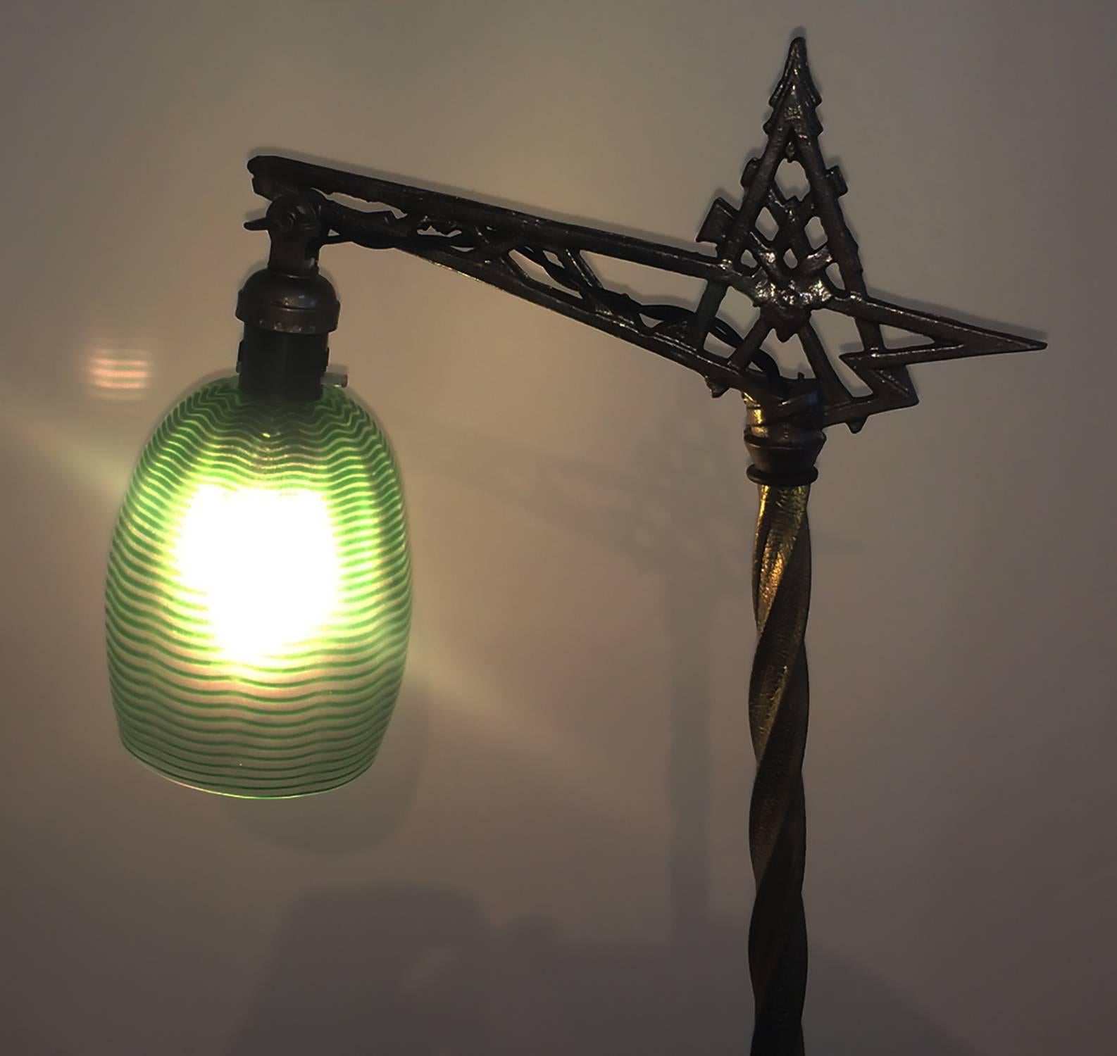 Art Nouveau American Bridge Floor Lamp with Jadeite Glass components, cast brass base and many decorative pressed brass Acanthus leaf decorations partly enclosing the Jadite, veined green milk glass, balls, lower disc and intermediate collars. There
