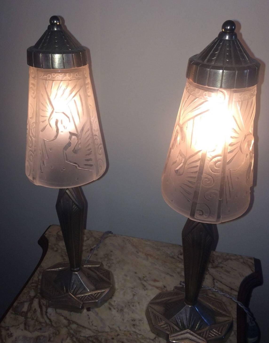 A rare pair of Art Deco bedside lamps, circa 1920. The original shades are signed by Muller Fres with silvered nickel bases. In excellent condition, these lamps are quite tall for this type of lamp at 43cm and throw an excellent light. Currently