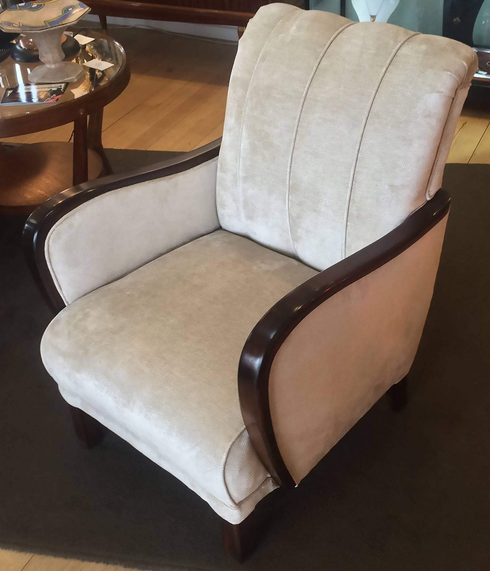 A beautiful pair of German lounge armchairs, circa 1930, completely reupholstered and French polished. Dimensions are approximate 66cm max. width x back height 85cm, seat height 45cm. These are very comfortable and have been reupholstered