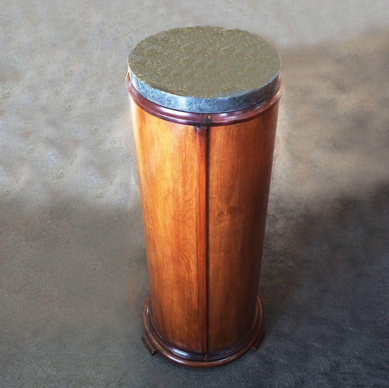Art Deco marble topped, cylindrical pedestal in walnut, with both stepped top and bottom edges, with three rolled edge feet, in solid, natural timber, French polished to perfection. Overall, in immaculate condition with no damage or losses.