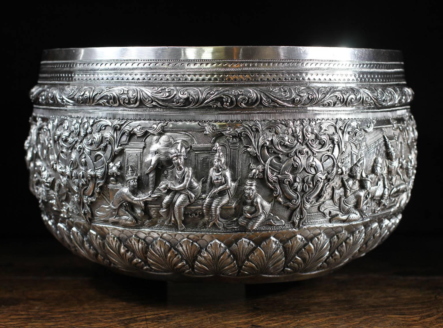 Very large Burmese (Myanmar) silver bowl, decorated with repoussed, chased and engraved scenes illustrating a Buddhist Jataka story, probably the ‘Life of Gaudama’, with Prince Vessantara & his wife & cildren, including an encounter with a tiger,