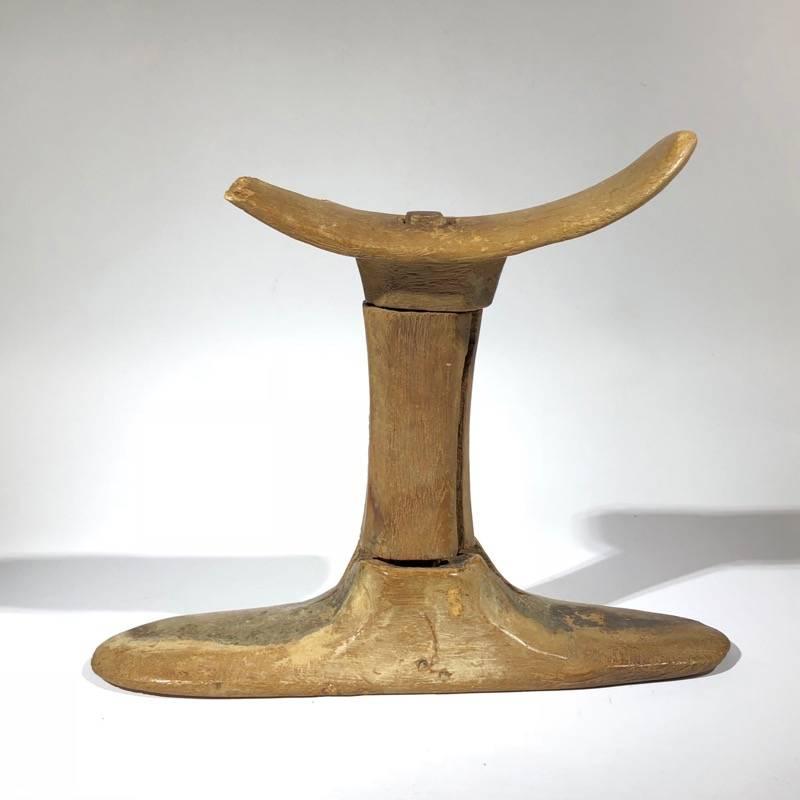 Carved cedar wood headrest, made in typical three-piece form. 
Old Kingdom, 
circa 2640-2134 BC.