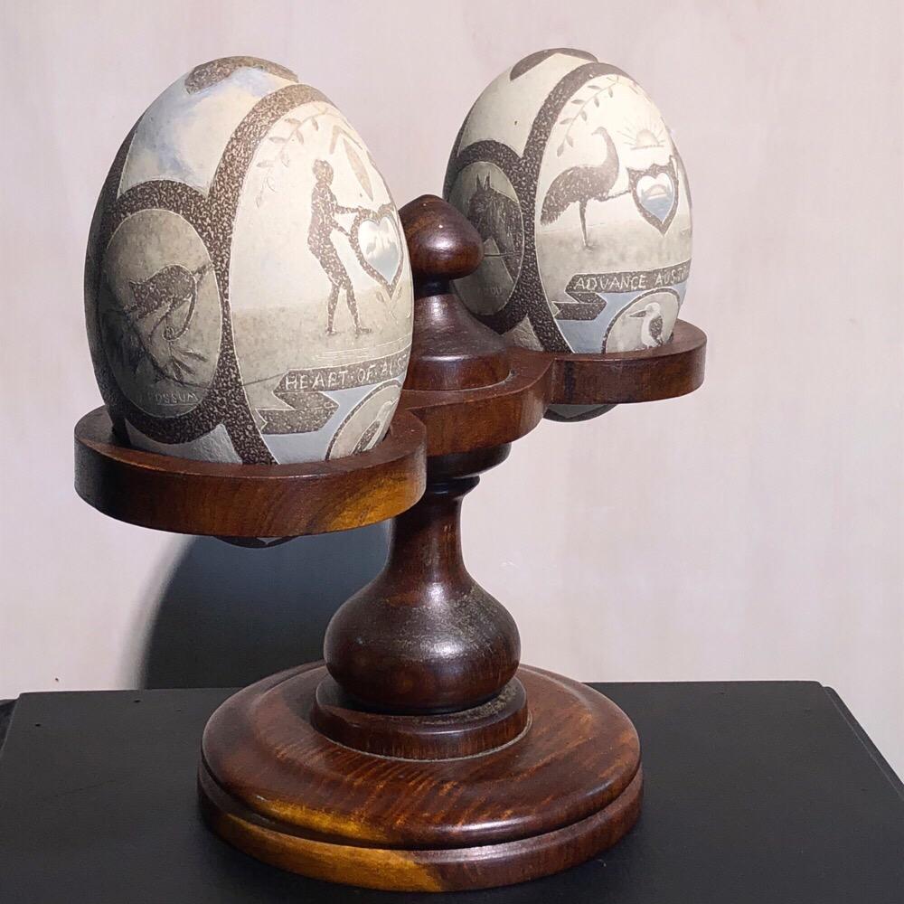Pair of remarkable Australian Emu eggs, superbly carved with four main panels and six smaller roundels, the larger being;
Heart of Australia / Advance Australia
Australia Years Ago / Australia Today
including Aboriginal figures and