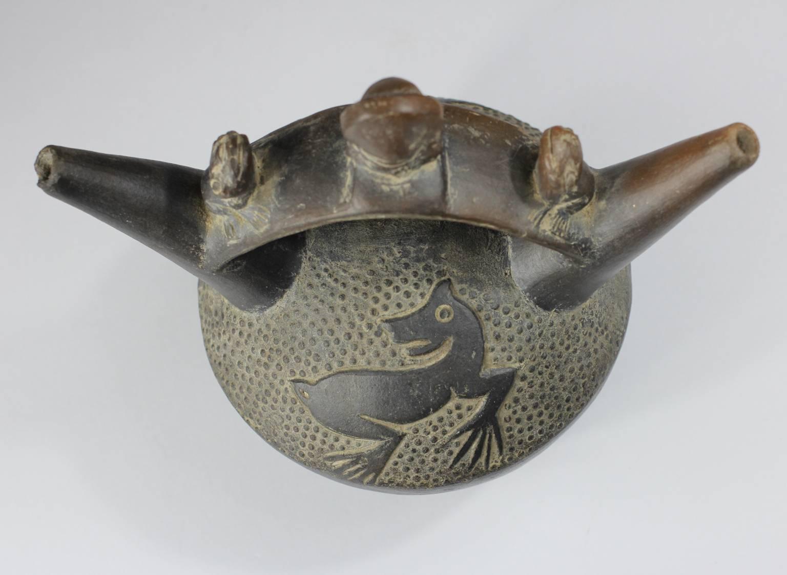 Pre-Columbian Chimu Blackware Stirrup Vessel, Warrior and Frogs, 12th Century