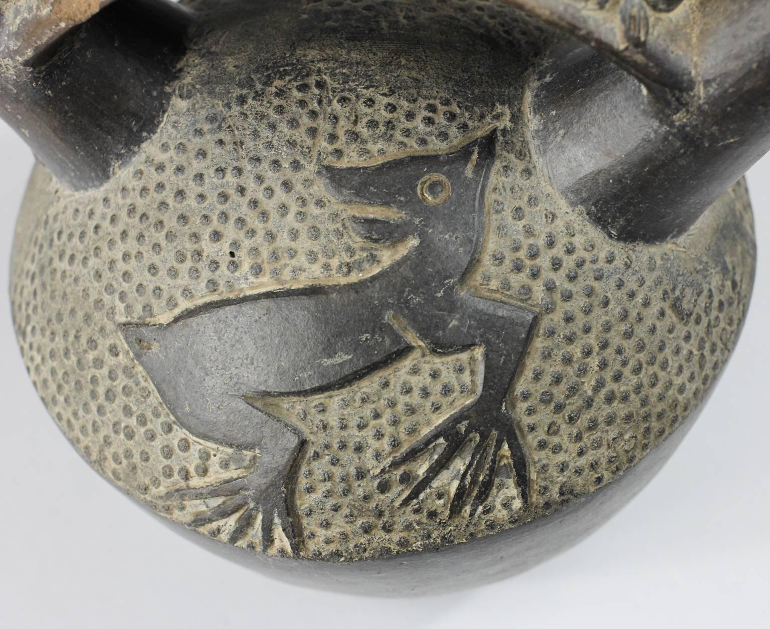 18th Century and Earlier Chimu Blackware Stirrup Vessel, Warrior and Frogs, 12th Century