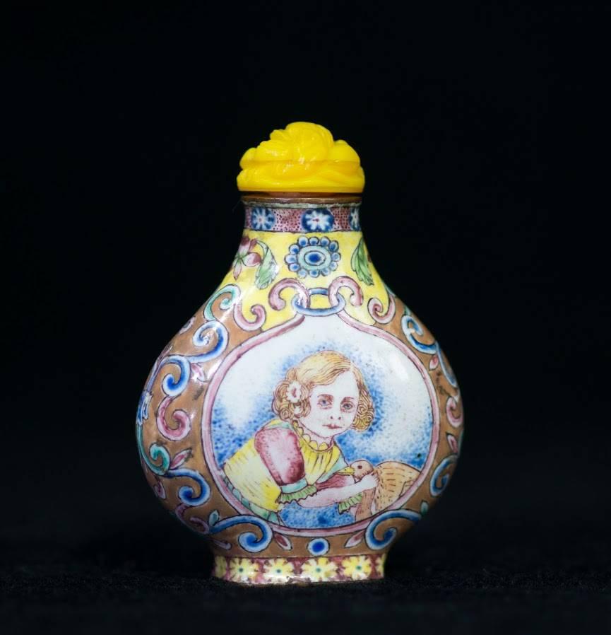 Chinese Canton enamel snuff bottle of small flattened globular form with short neck and rectangular foot, well painted with European subject panels of pretty girls, probably after a Dutch print. Unmarked, Qianlong period, late 18th century.