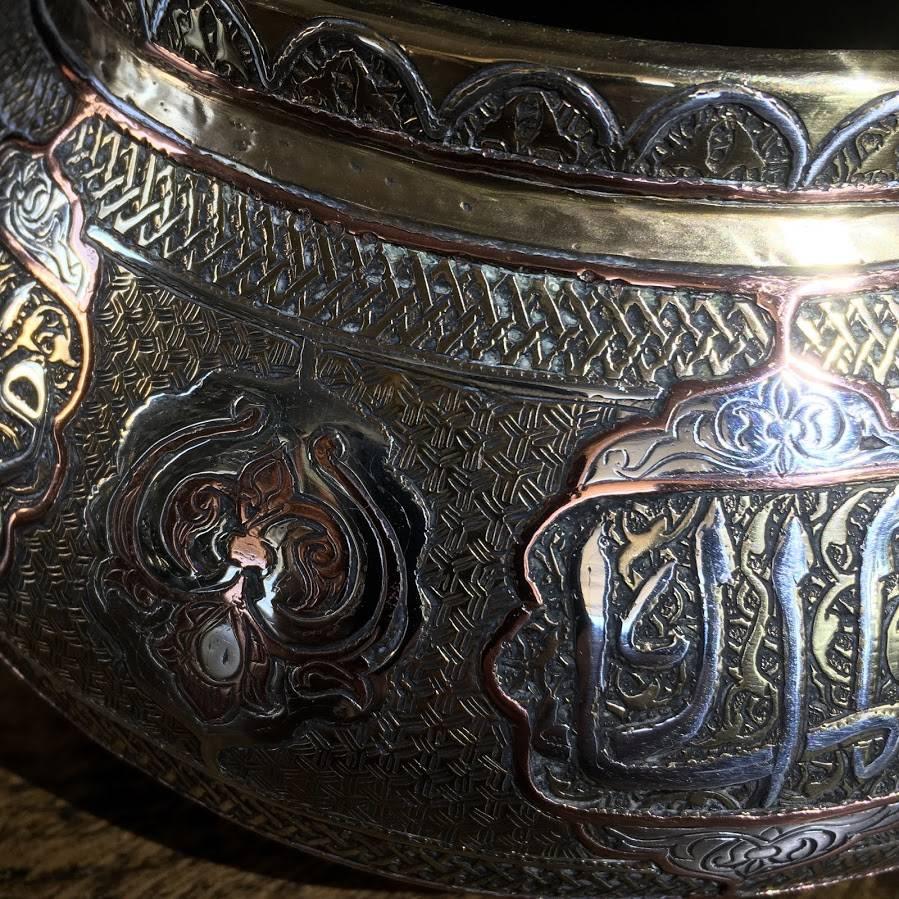 Quality brass and silver Damascus ware vessel, with panels of stylised Islamic inscriptions, 19th century.