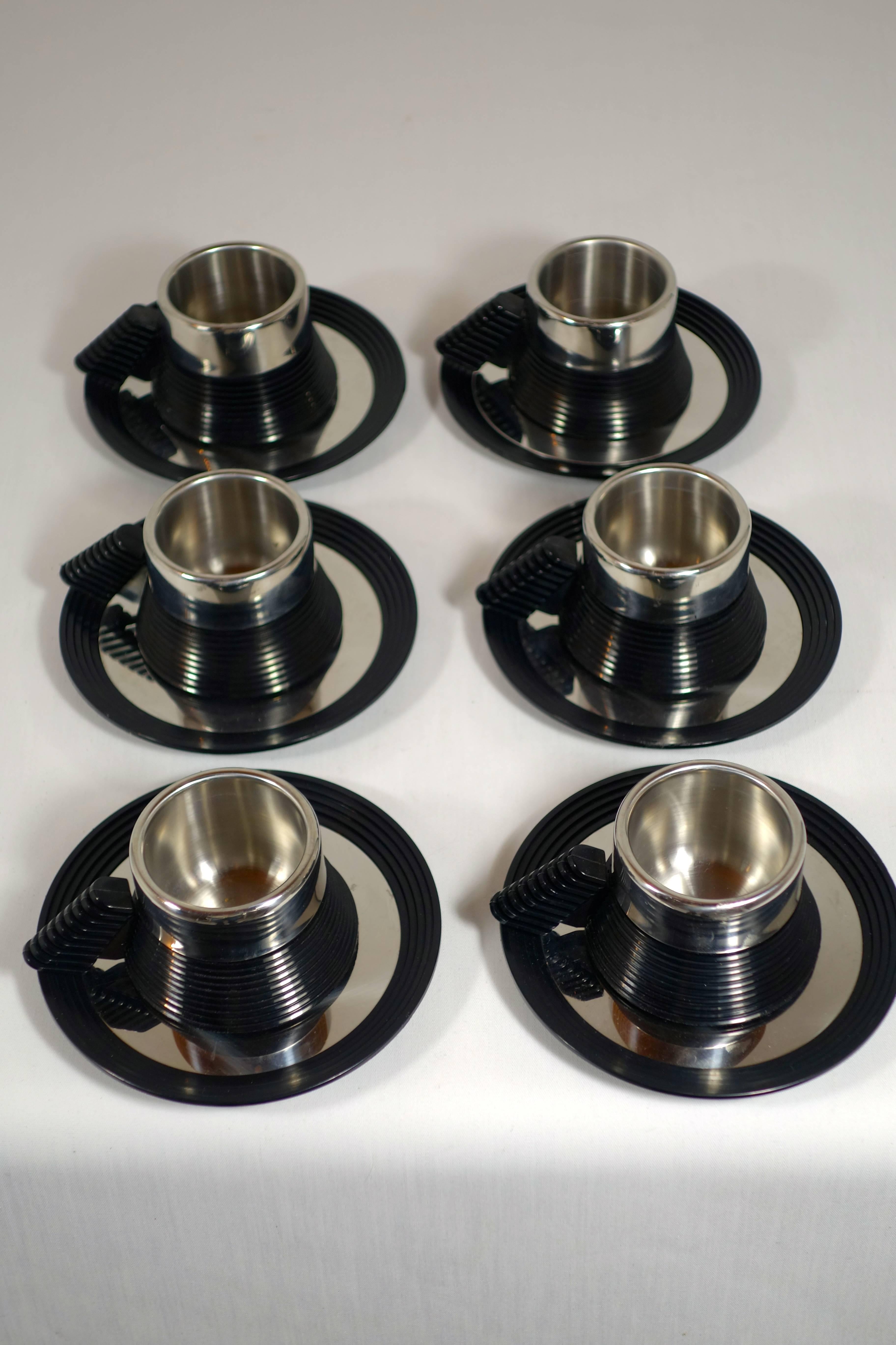 Postmodern Espresso Cups and a Serving Tray designed by Carlo Giannini .

Set of six espresso cups and saucers made of stainless steel and ABS plastic plus a serving tray designed by Carlo Giannini, circa 1970.

Featured in several scenes of the