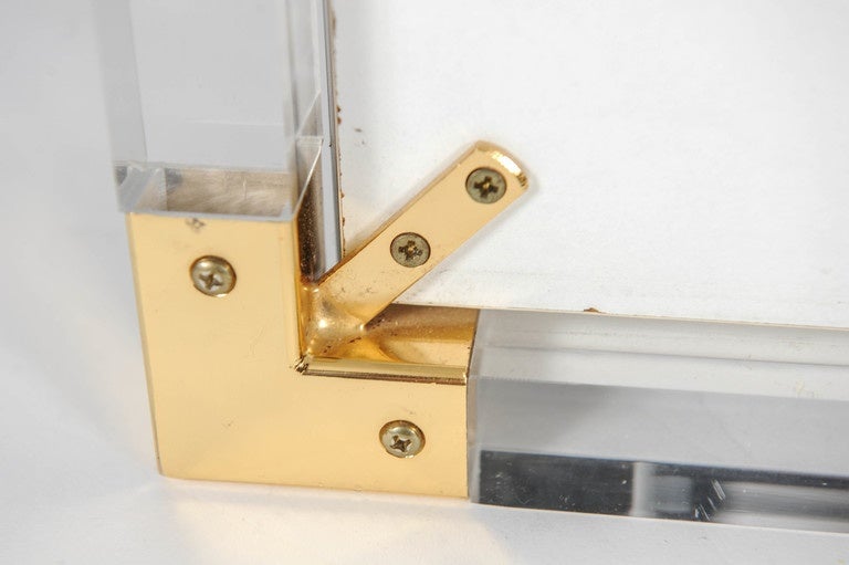European Lucite Framed Mirror with Brass Details