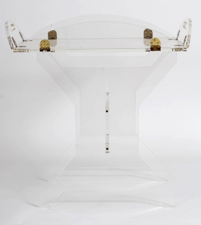 Very elegant ste of a Tray and a Stand both made of plexiglass. 
The tray normally is 54 cm (21 inches) long and 33 cm (13 inches) wide. Due to the hinge joints it may be extended to a size of 68 cm (27 inches) long and 49 cm (19 inches) wide.
The