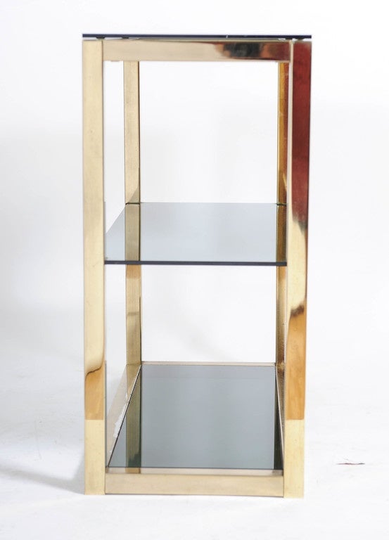 Italian Hollywood Regency Etagère in Shiny Brass and Smoked Glass by Renato Zevi For Sale