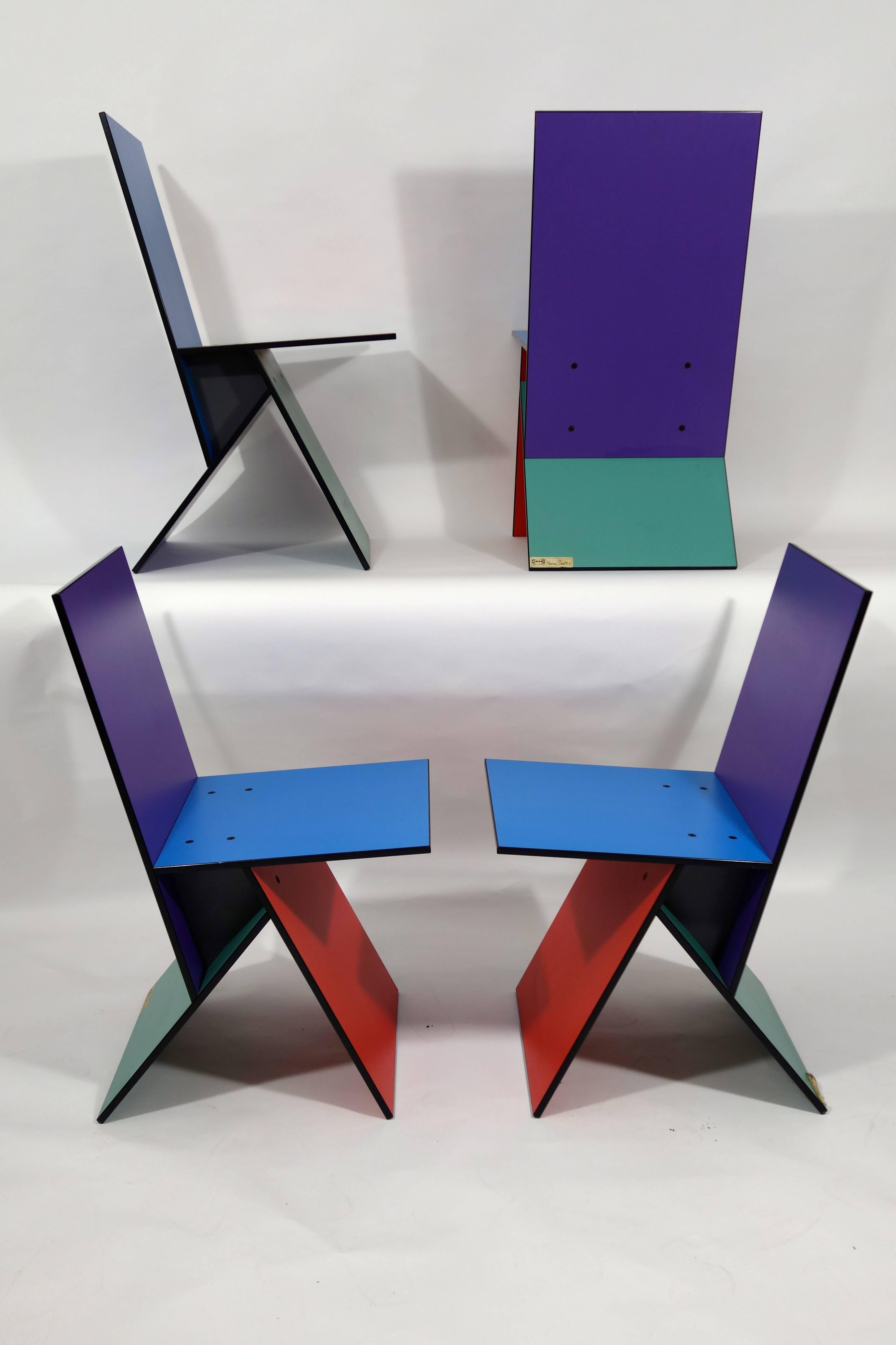 Set of four rare Vilbert Chairs designed in 1993 by Verner Panton for Ikea. Only about 4,000 of these chairs were manufactured.

The chairs consist of four multi-colored MDF boards screwed together.

Vilbert came in two color schemes: Three of