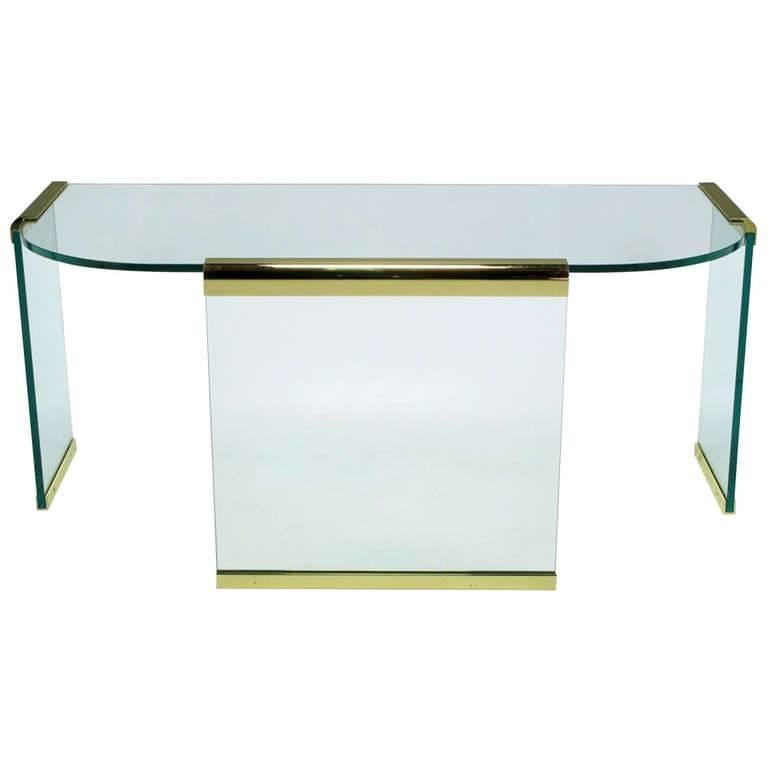 20th Century Brass and Glass Desk by Leon Rosen for Pace Collections. 

Vintage Postmodern 1970s four piece glass desk with brass bracing from the iconic Pace Collection by Leon Rosen. This particular desk comes with all original parts and one extra