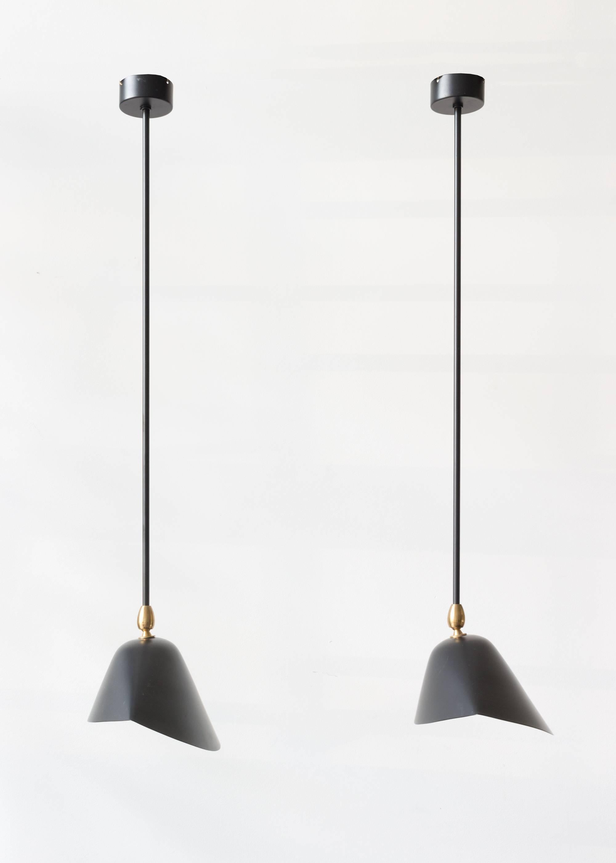 Serge Mouille "Library Pendant" 

The tripod shade is a classic Serge Mouille icon. The body and shade are made from molded lacquered metal, the interior of the shade is finished in lacquered white to reflect the light. Hardware and