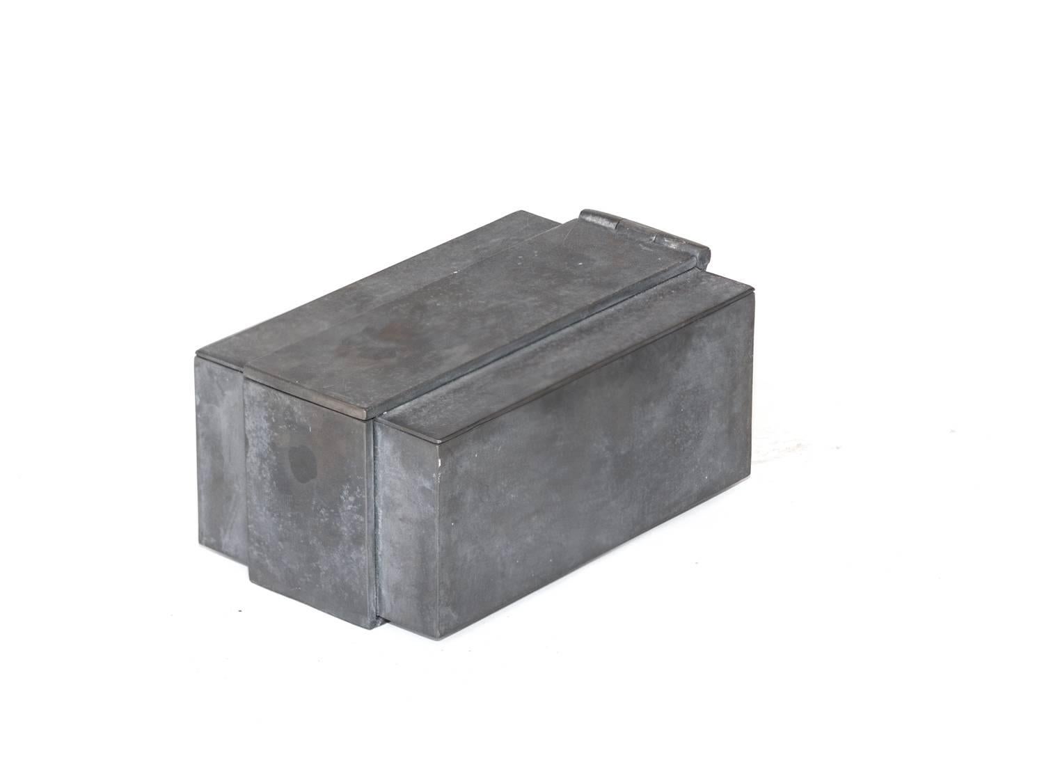 Description: Medium sized metal box by Parts of Four Home (P4H)

Material: Patinated Iron

Due to the acid-wash patina, each item has a unique finish. 

Dimensions: 

6.5W x 6.5H x 6.25D in
16W x 16h x 17D cm

Manufacturing Date: 2015