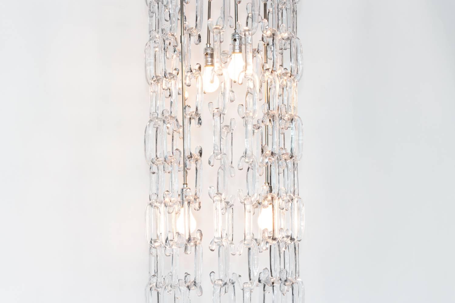 This stunning example of Murano's chain link chandelier came from a private villa in Italy, the owner commissioned the extra-large fixture in 1960. The lamp is modular and can be reconfigured in countless ways. It can be put over a table at 58