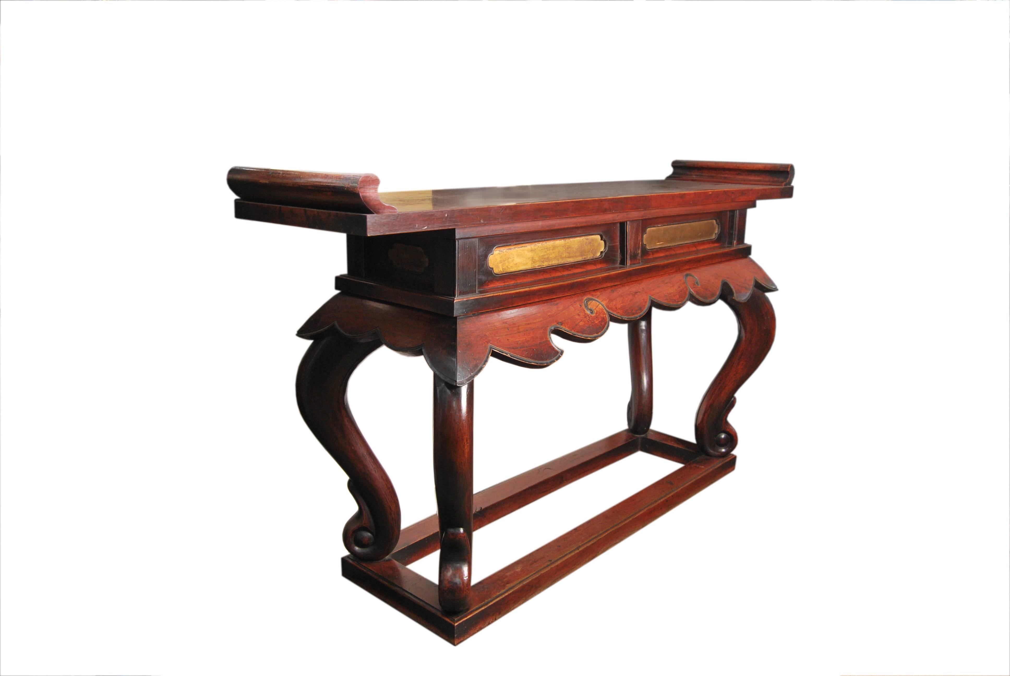 Rare Japanese Buddhist altar table built entirely from zelkova (Japanese elm) wood with a lustrous reddish toned fuki-urushi wiped lacquer finish and patinated by incense smoke in its original setting.

Adorned with gilded paneling inset above a