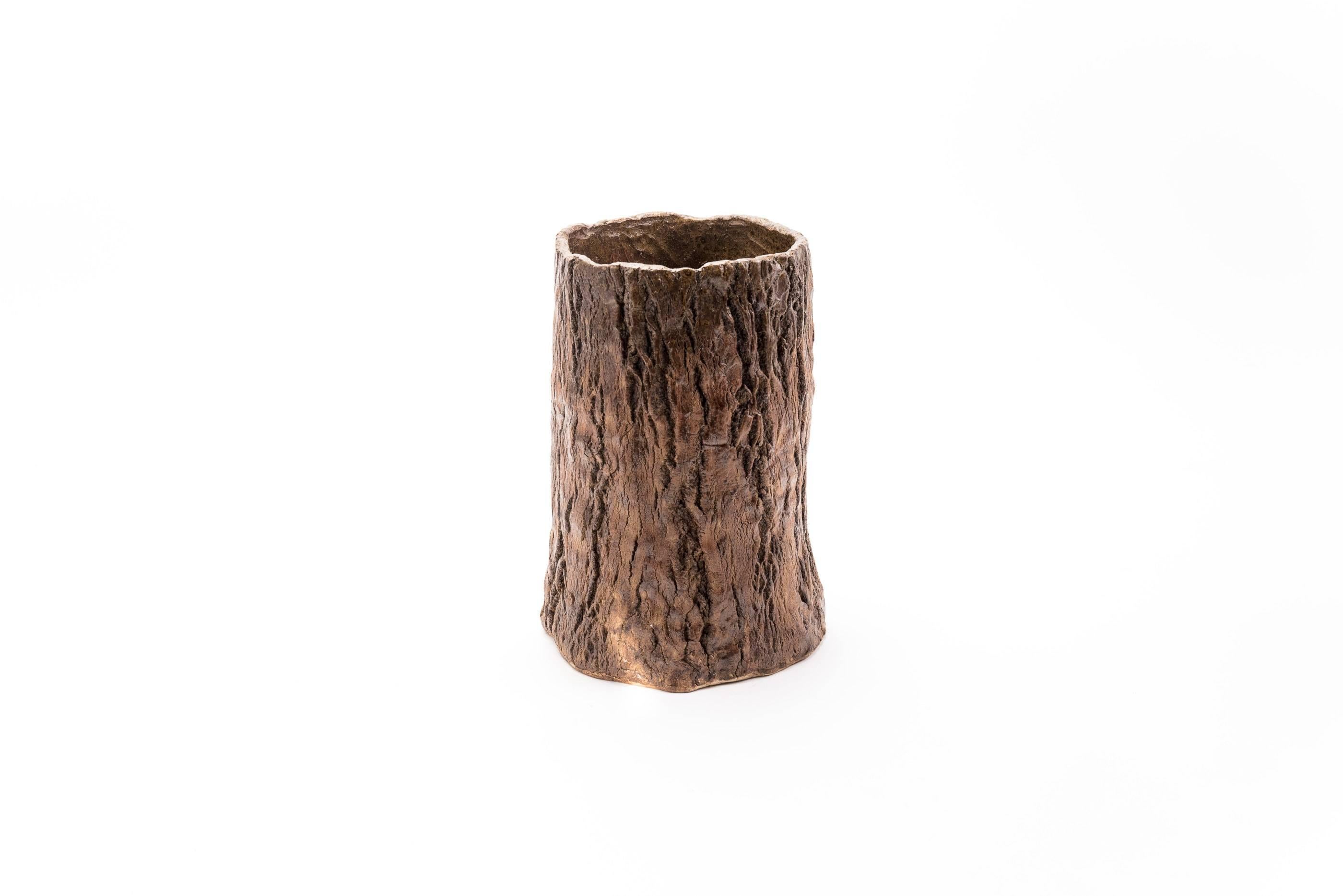 Contemporary Japanese studio vase in realistic imitation of a tree trunk with textured bark. The piece has been hand built with visible markings on the interior.

Material: Ceramic

Age: Contemporary (less than 20 years).

Please note: All ceramic