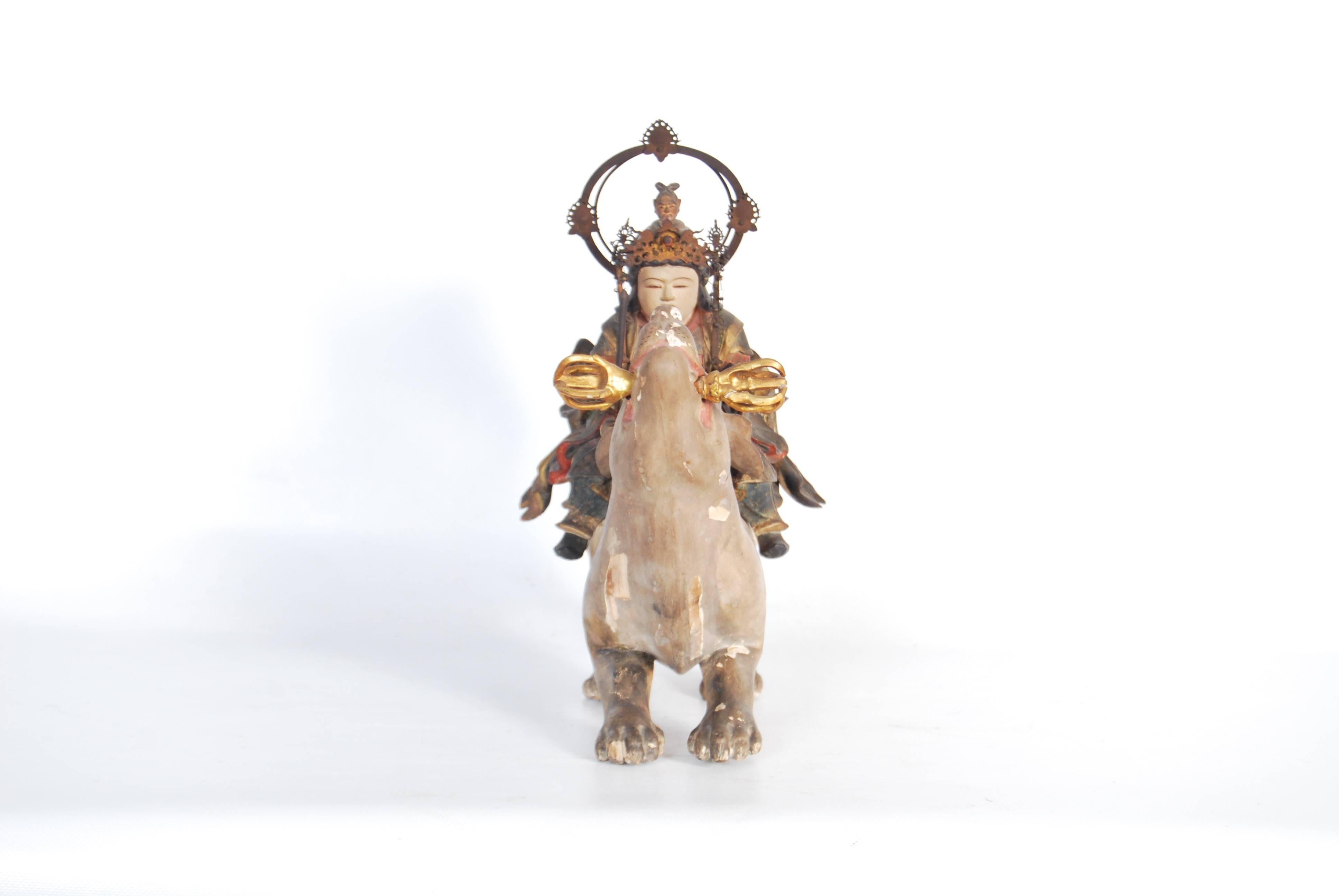 Rare and highly unusual antique Japanese statue of the esoteric deity 'Dakini Ten,' a Buddhist goddess who was associated with the agricultural deity Inari in Japan, and is represented atop a holy white fox (often linked with Inari) clutching a