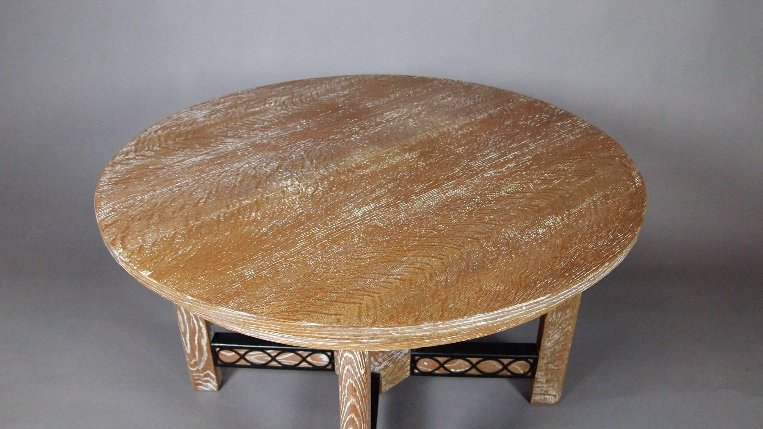 Beautiful round cerused oak extension table, (without extra leaves). Extended would seat ten. There is decorative metal detailing to the base of the table. The table comes with four chairs in original velvet fabric.