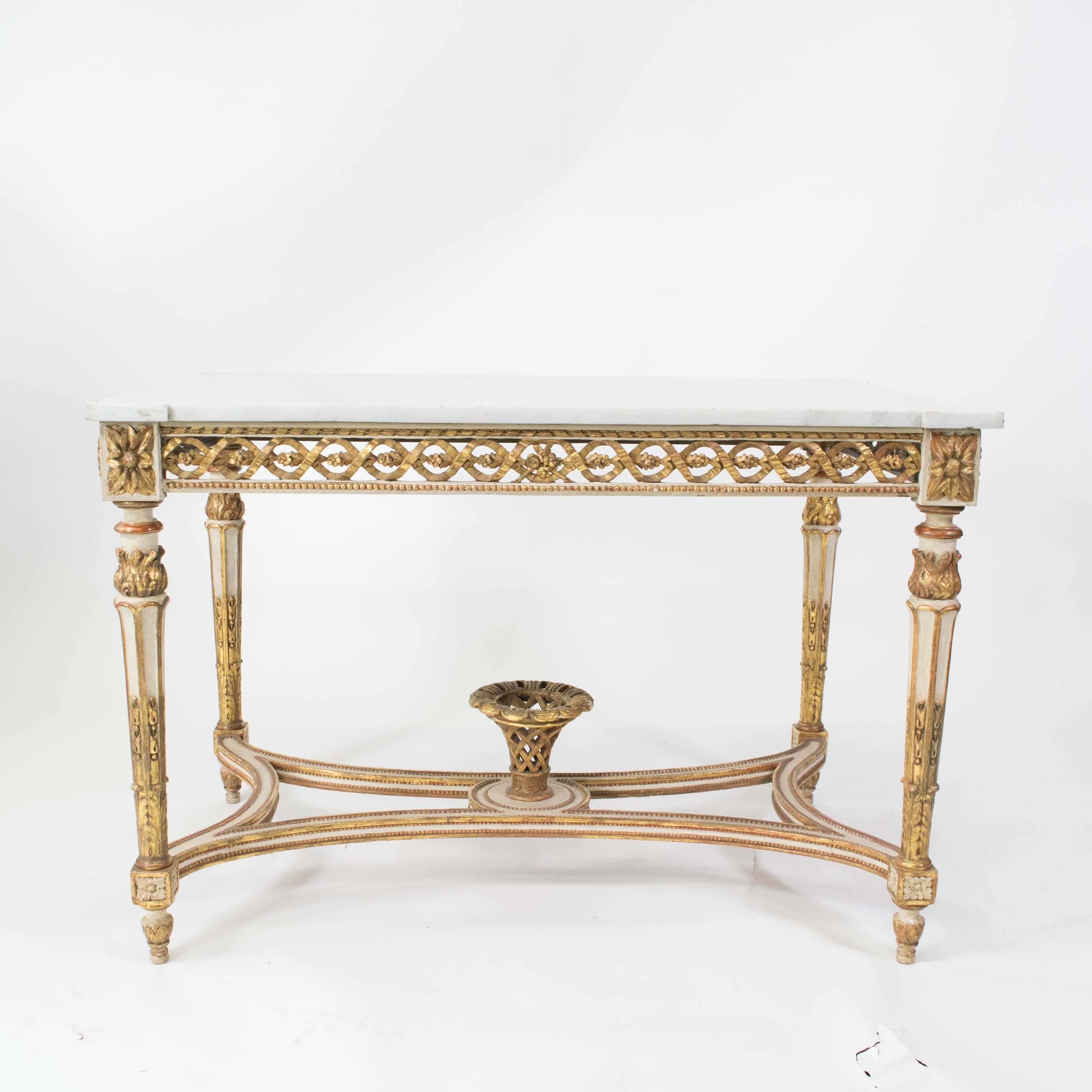 Albertina palace centre table, in the neoclassic style, oak and carved pine, white painted and giltwood, retaining the original shaped marble top.
Vienna, circa 1770.

Provenance: The pair to this table remains at the Albertina Palace, Vienna