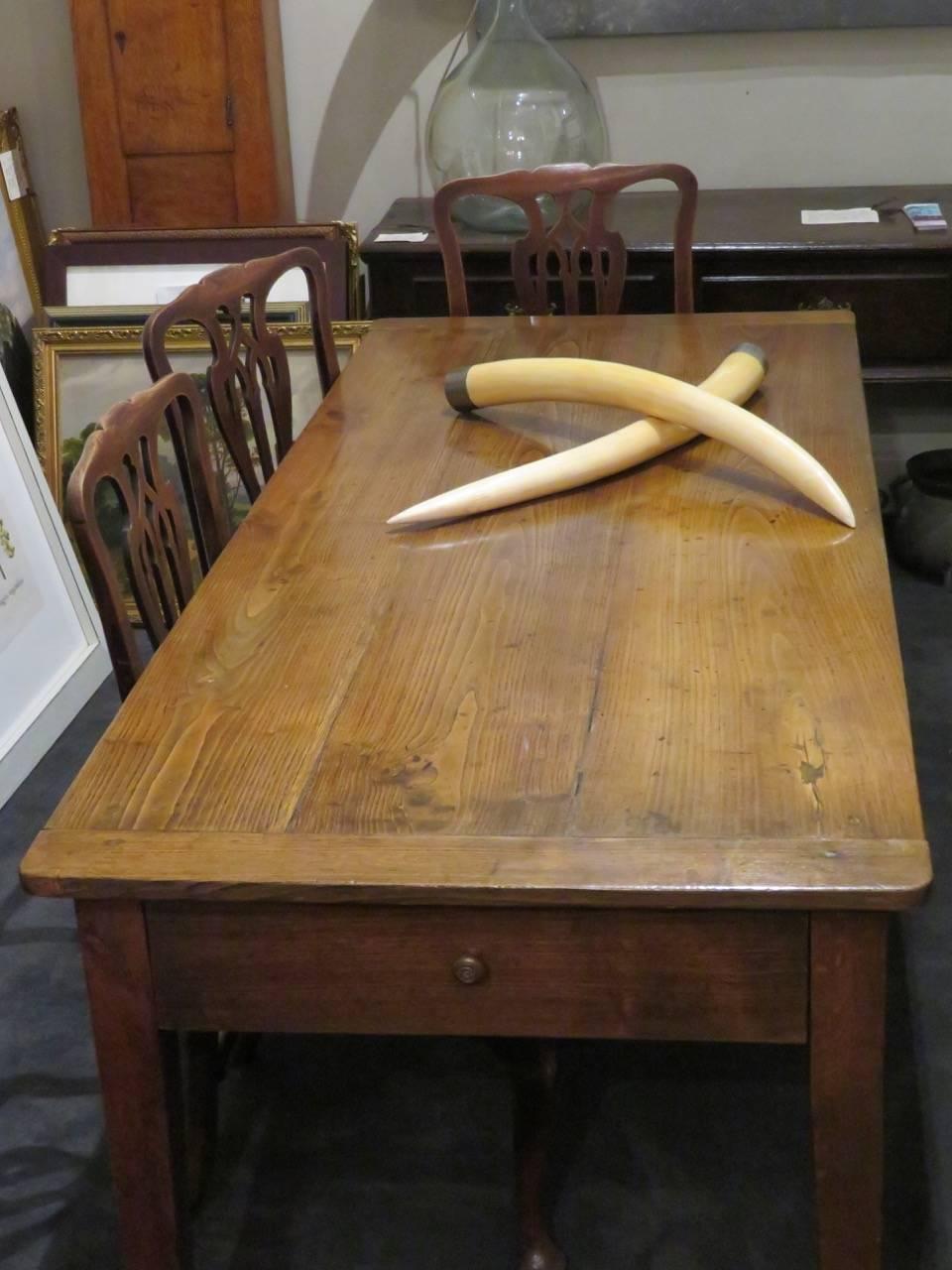 Mid-19th Century French chestnut and oak dining table of good proportions The three plank cleated top above a plain frieze, one end having a single drawer, retaining the original turned handle. Resting on square tapered legs, 

circa