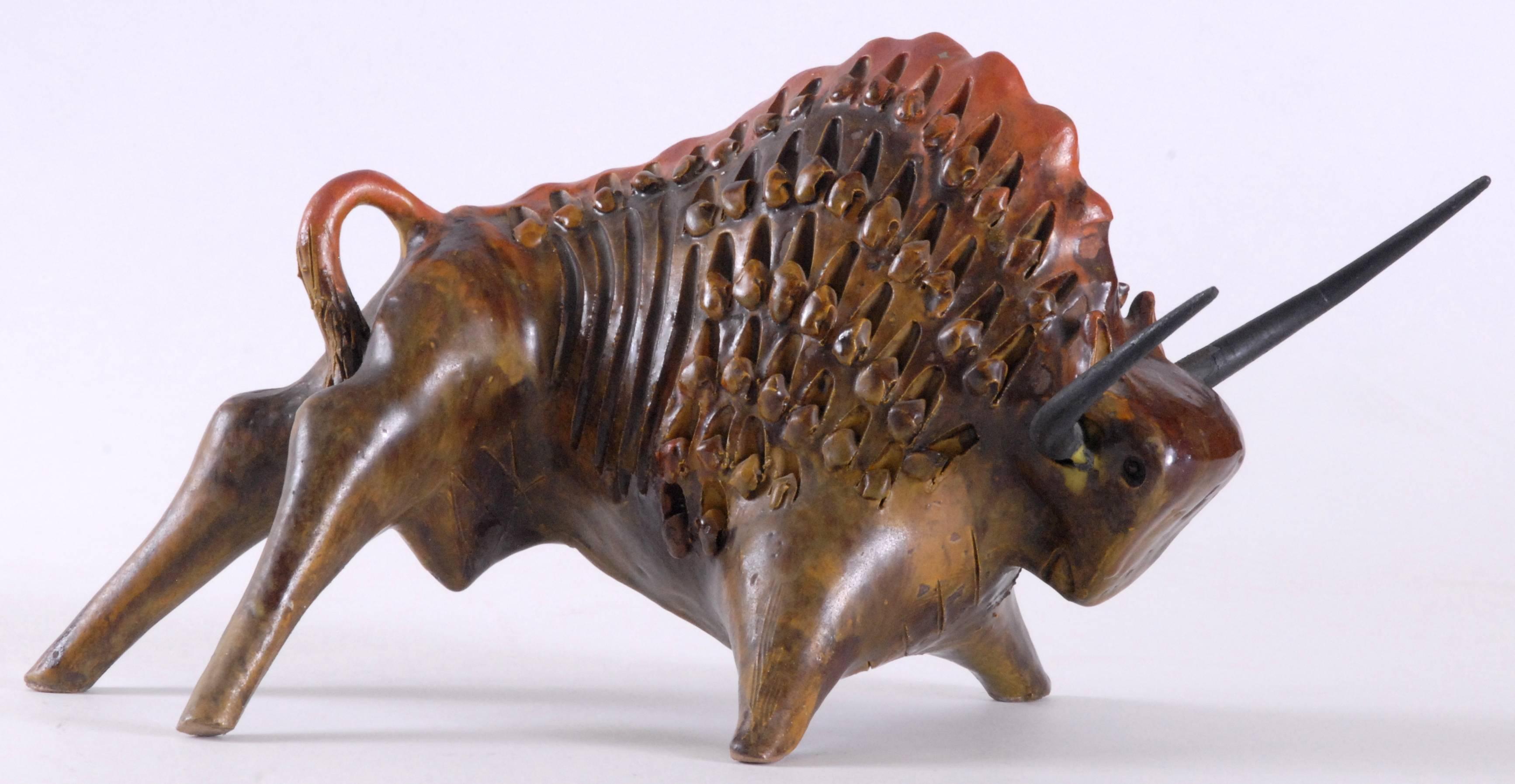 A very stylized bull typical of the period, aggressive, powerful and impressive. In perfect condition with the steel horns retaining their original finish. Stamped 'ITALY' on the bottom of one hoof. Bagni was a master designer and potter and also