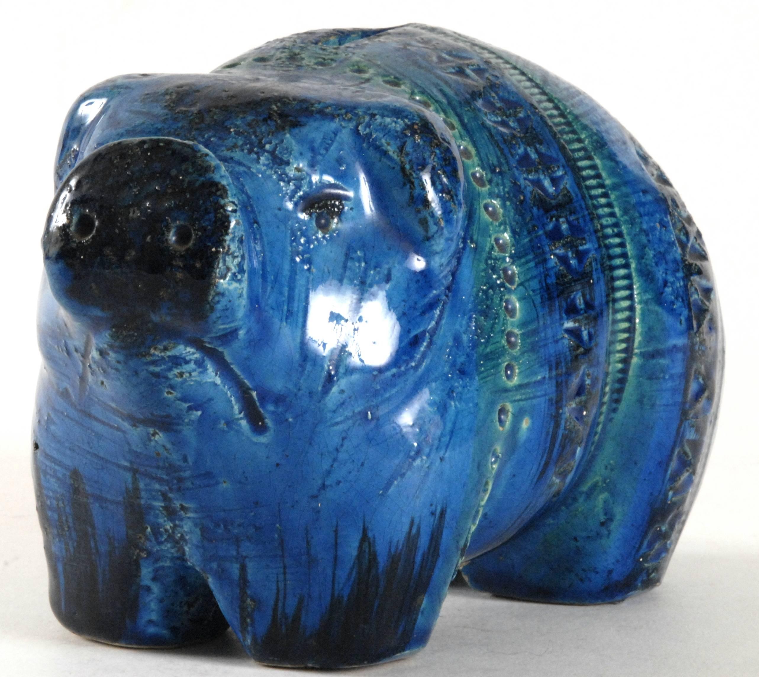 A 'Rimini Blu' money box in the form of a pig with original plastic stopper to the opening in the base. Beautiful brilliant blue glaze, this piggy will hold 'squillions' in spare change, a very good Christening present for that loved child in one's