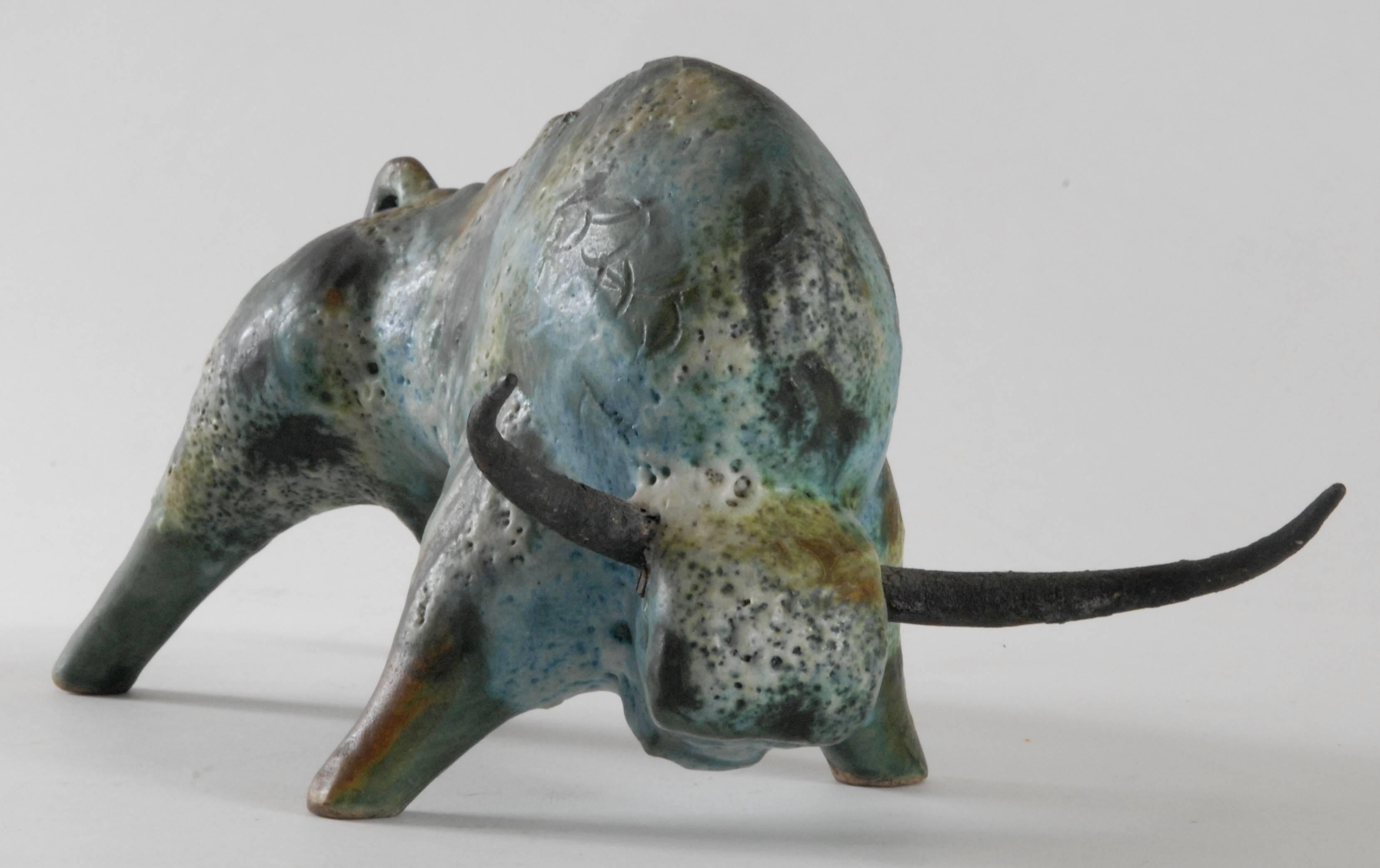 A powerful and expressive piece by Alvino Bagni in his signature 'Sea Garden' glaze. Original steel horns and impressed 'ITALY' mark to front left hoof. A very tactile glaze, both frothy and lustrous.
