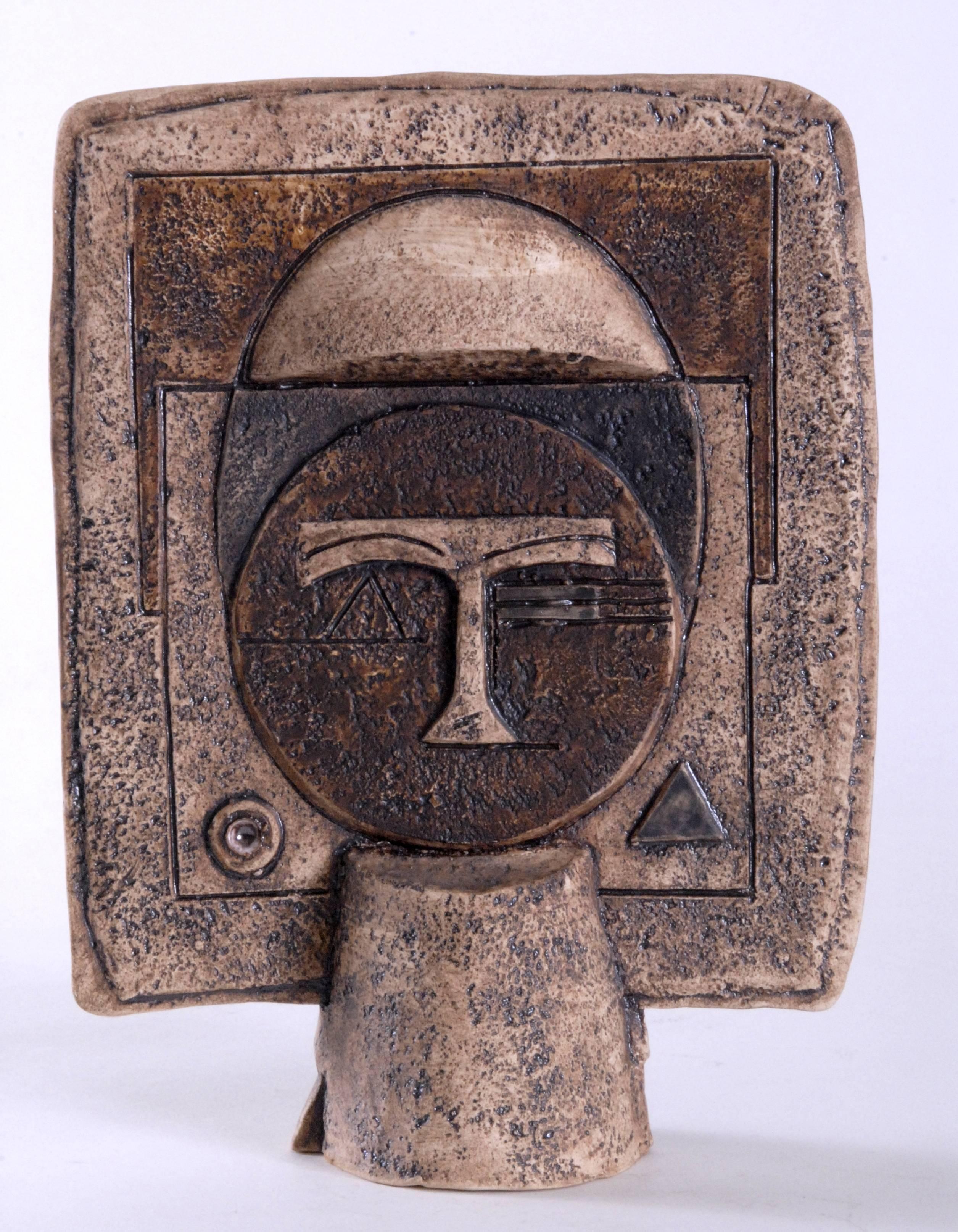 Troika sculptural ware was produced just after moving to Newlyn, the 'Mask' being the fourth design in the series. One side portrays an Aztec style face and the other a Paul Klee abstracted face trying to show the links between ancient history and