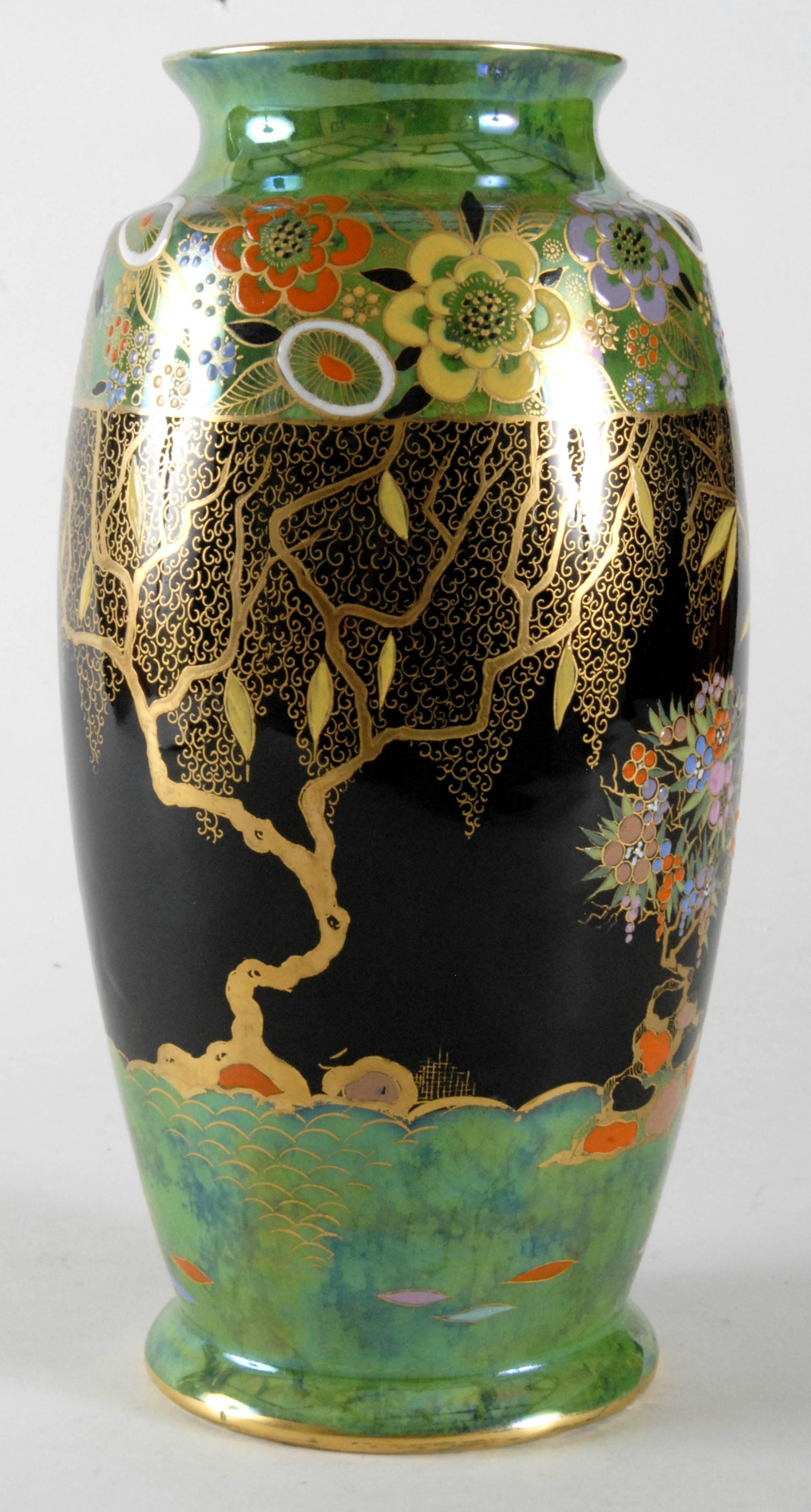A large Carlton Ware vase from, circa1935 with the Mandarin Tree pattern with the green/black color way variation. Superbly hand painted and gilded in near excellent condition. A couple of the paint globs have come off over the years, but hardly