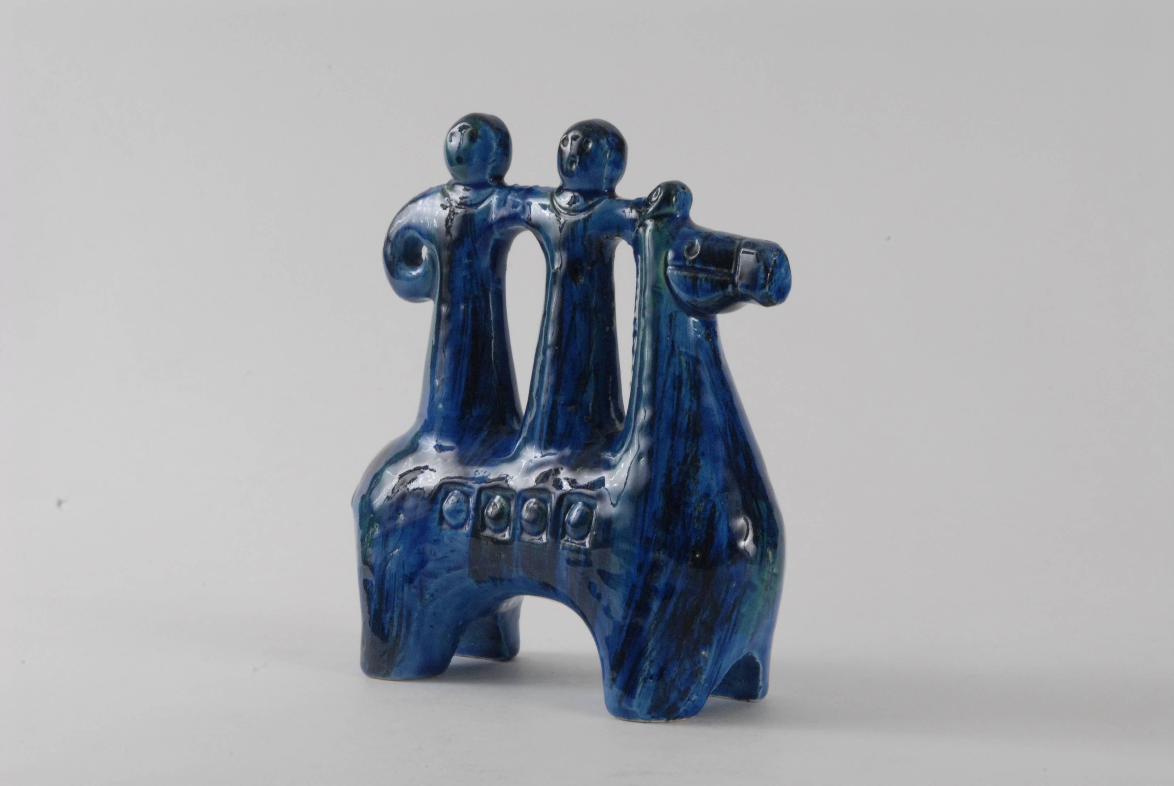 A lovely small Rimini Blu decorated horse with two riders by Aldo Londi for Bitossi, circa 1968.