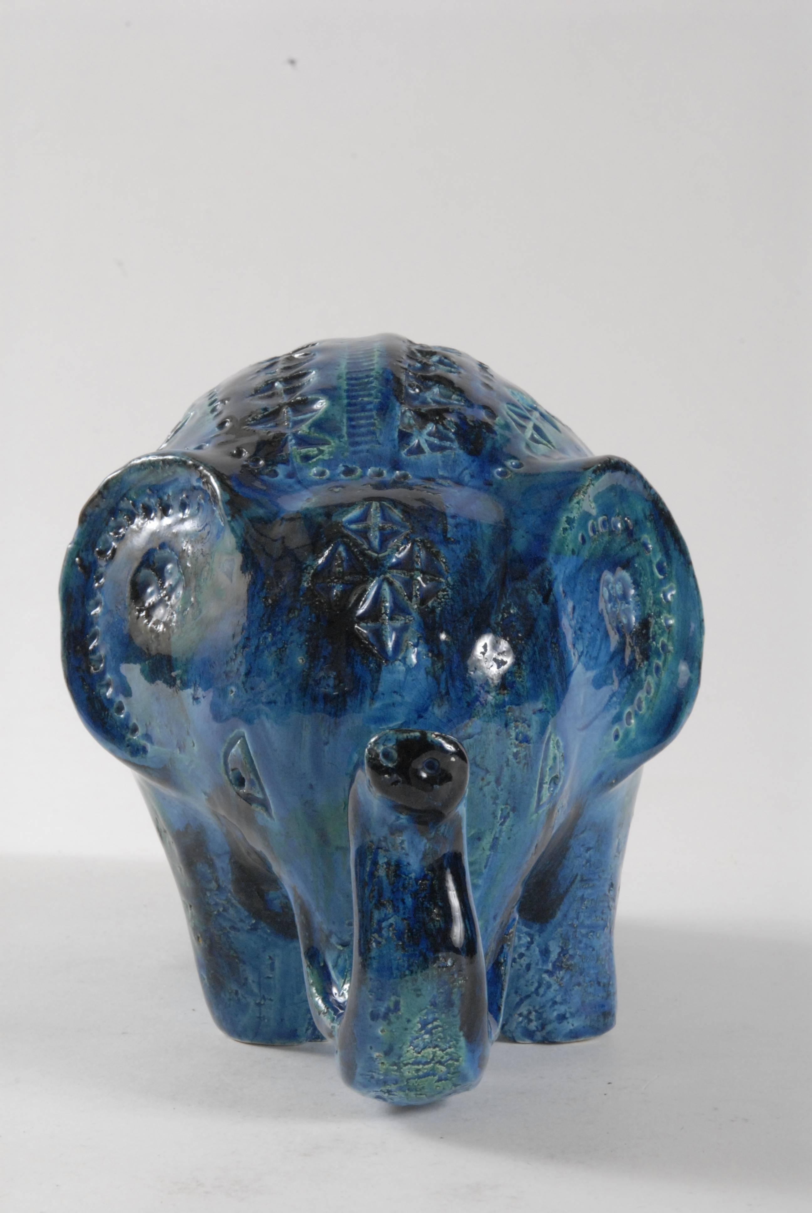 A large beautiful, friendly Italian elephant in a liquid blue glaze, is well fed and in great condition, marked underneath.