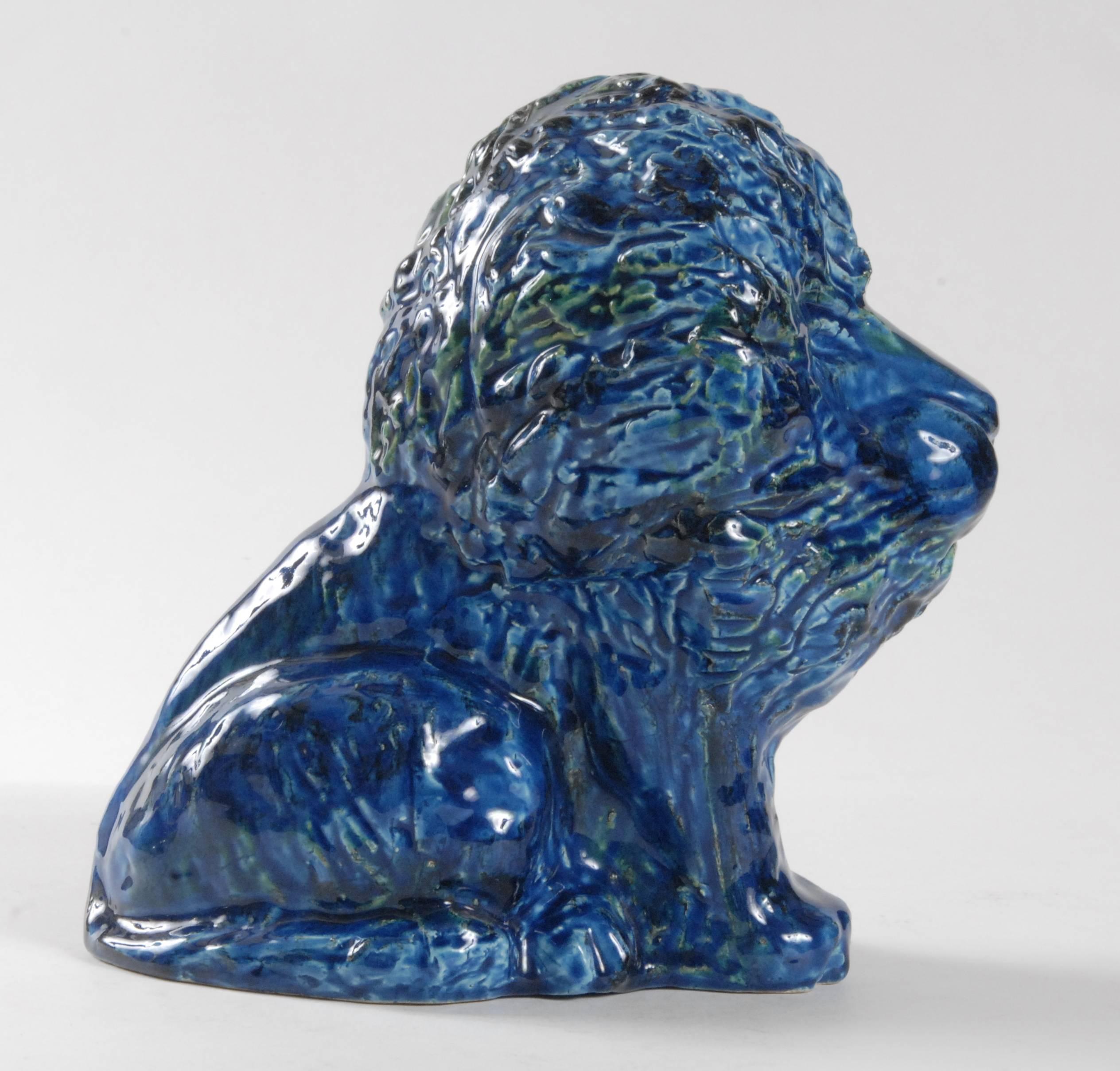 A large sitting lion designed by Aldo Londi for Bitossi in circa 1965. Very expressive, contented animal in a brilliant blue glaze.
