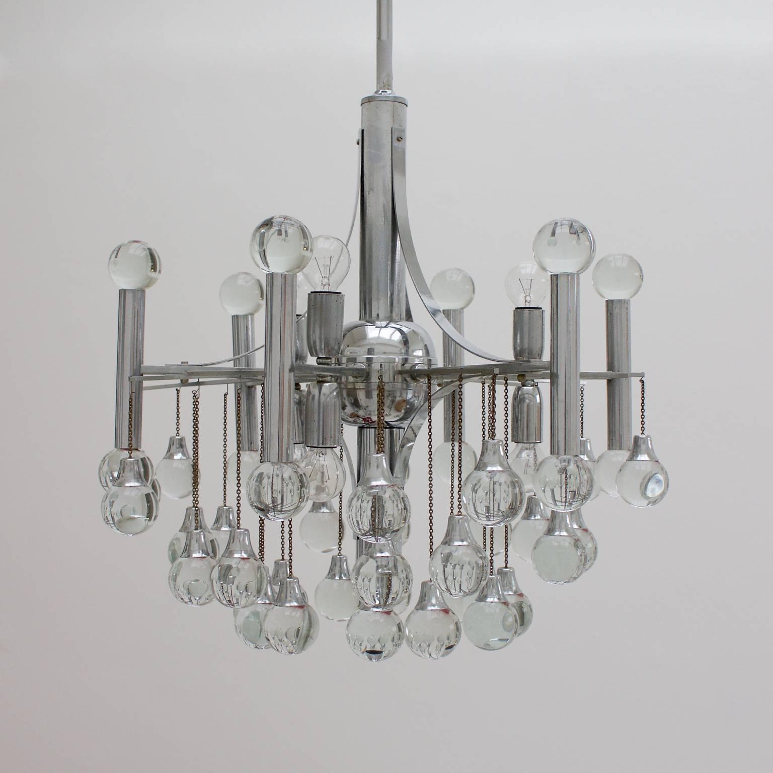Chandelier by Sciolari, with chrome body and 48 glass balls - 12 on the six main verticals and 36 hanging on chains of varying heights (all in place). The piece has seven lights (three pairs of uplighters/downlighters taking SES bulbs and a single