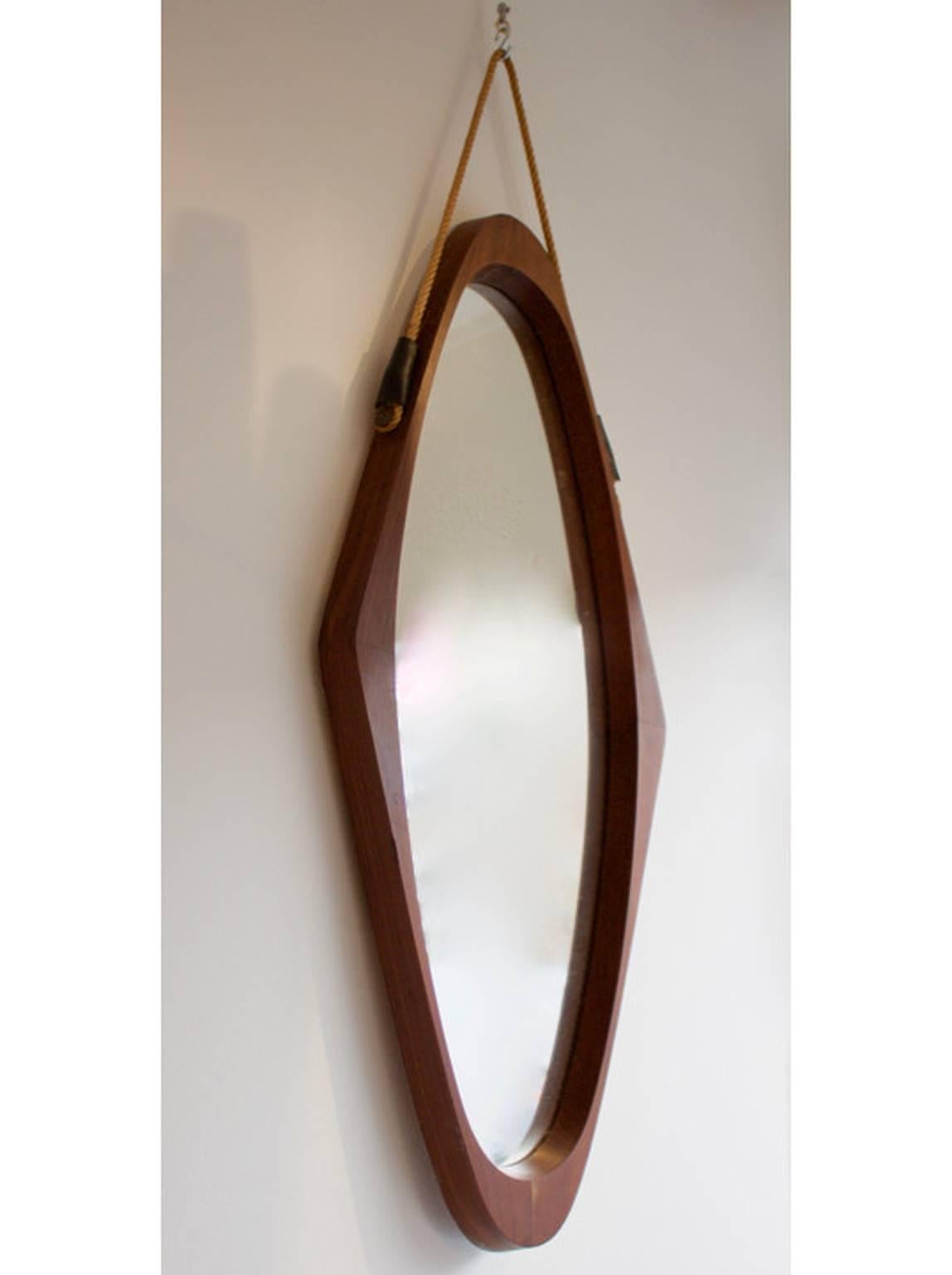 Large oval mirror with solid teak frame, and leather details, Italy, 1950s.

Very good original condition, with slight warping to the back board.

Dimensions: H 93cm x W 43cm x D 5cm.

We have a number of teak mirrors coming into the shop