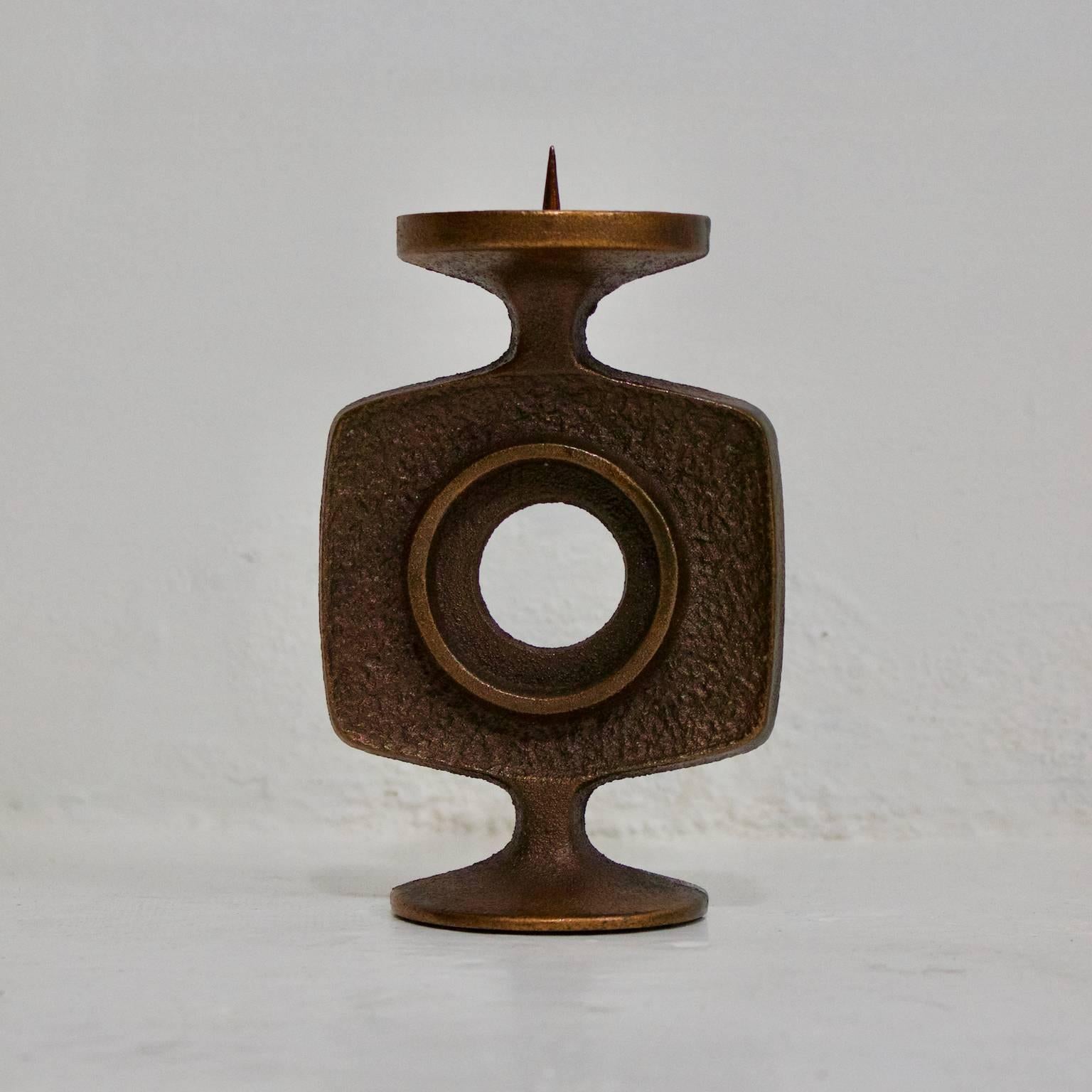 Small Brutalist candlestick, Germany, 1960s.

A stylish piece - alloy finished in brass or bronze - probably sand-cast, with a textured finish and a felt base. Very good original condition.