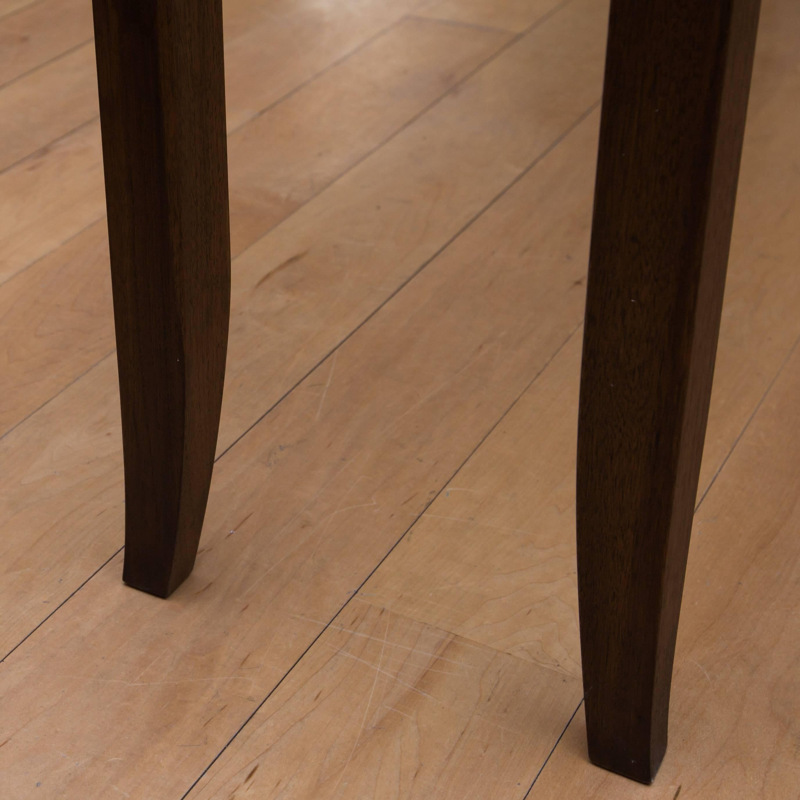 This custom console table with its alabaster stone top and solid walnut legs and frame is another one-off by master furniture maker Gregory Clark.
 