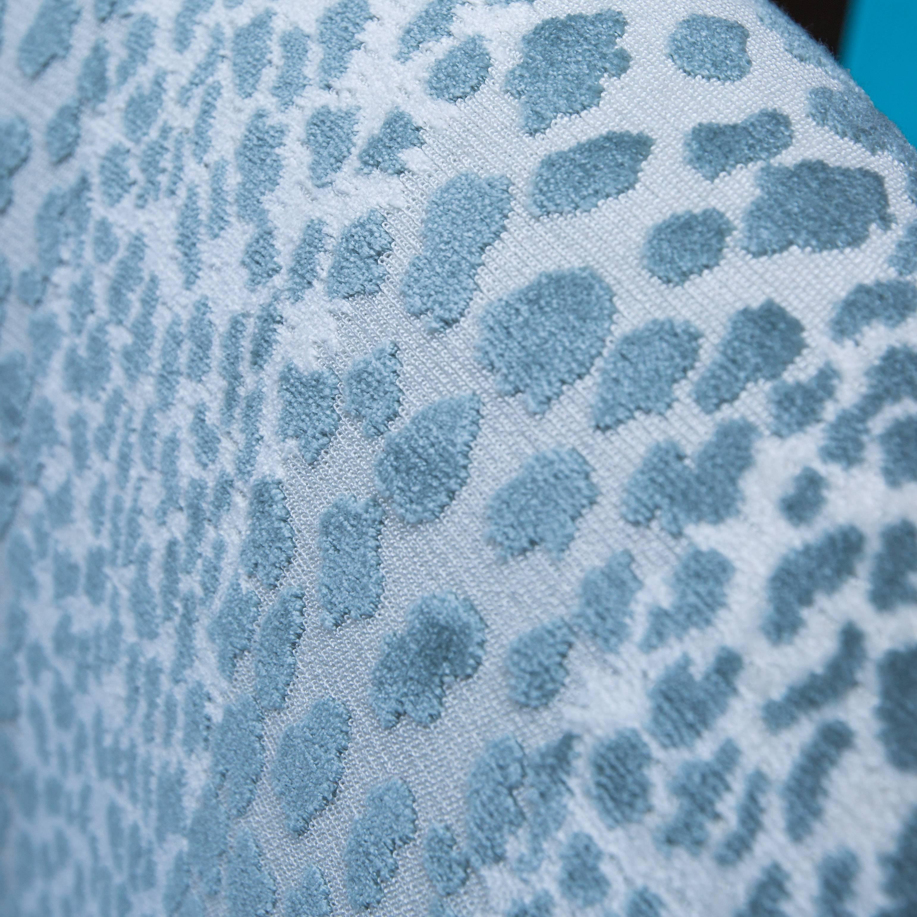 Custom-made swivel chairs that turn easily 360° newly upholstered in a Candice Olsen designed fabric for Kravet.